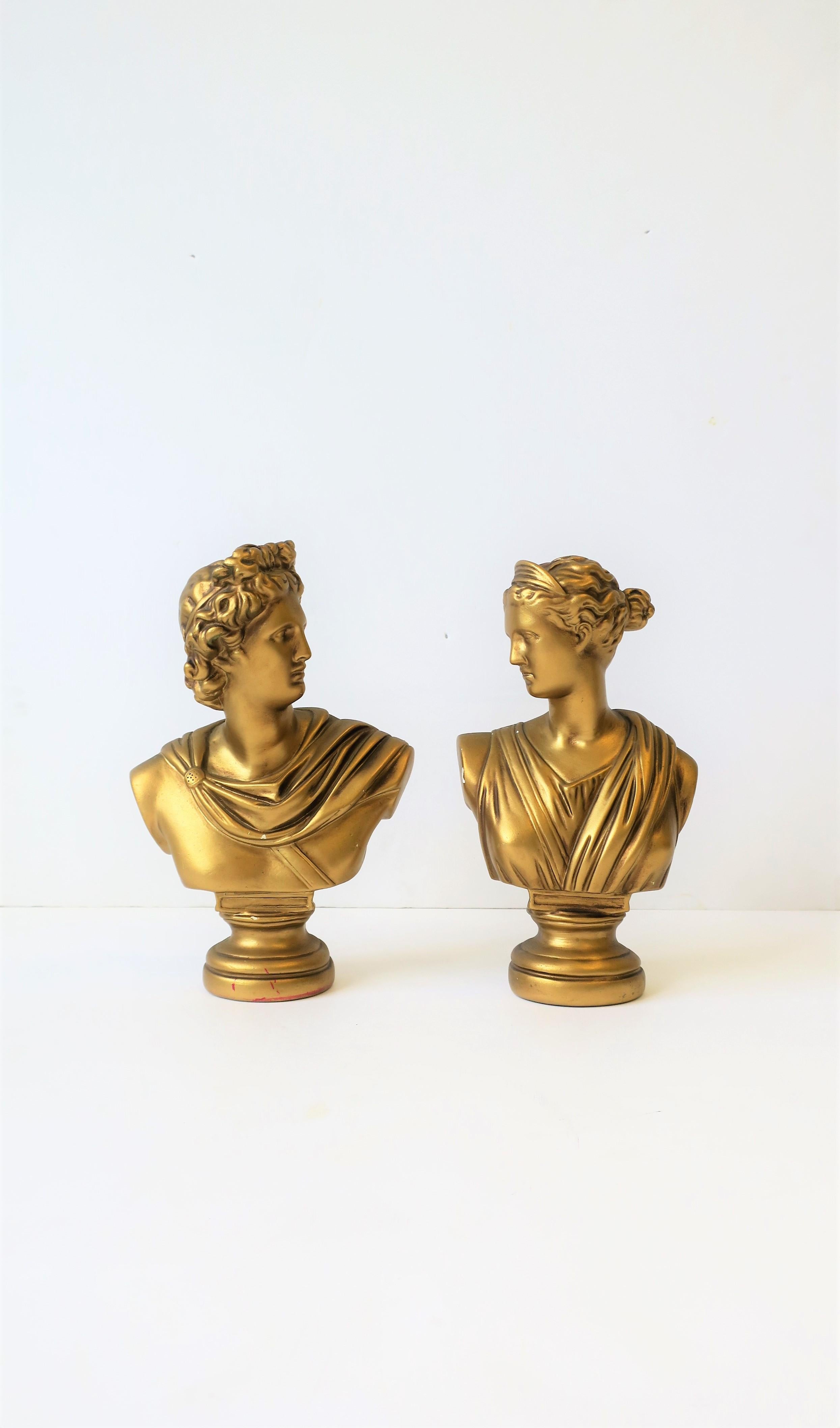 A beautiful pair of midcentury Italian male and female classical Roman style bust statue sculptures. Pieces are plaster with a gold overlay. 

Bust measurements: 
Male: 11 in. H x 7 in. W 
Female: 10.5 in. H x 6 in. W.

