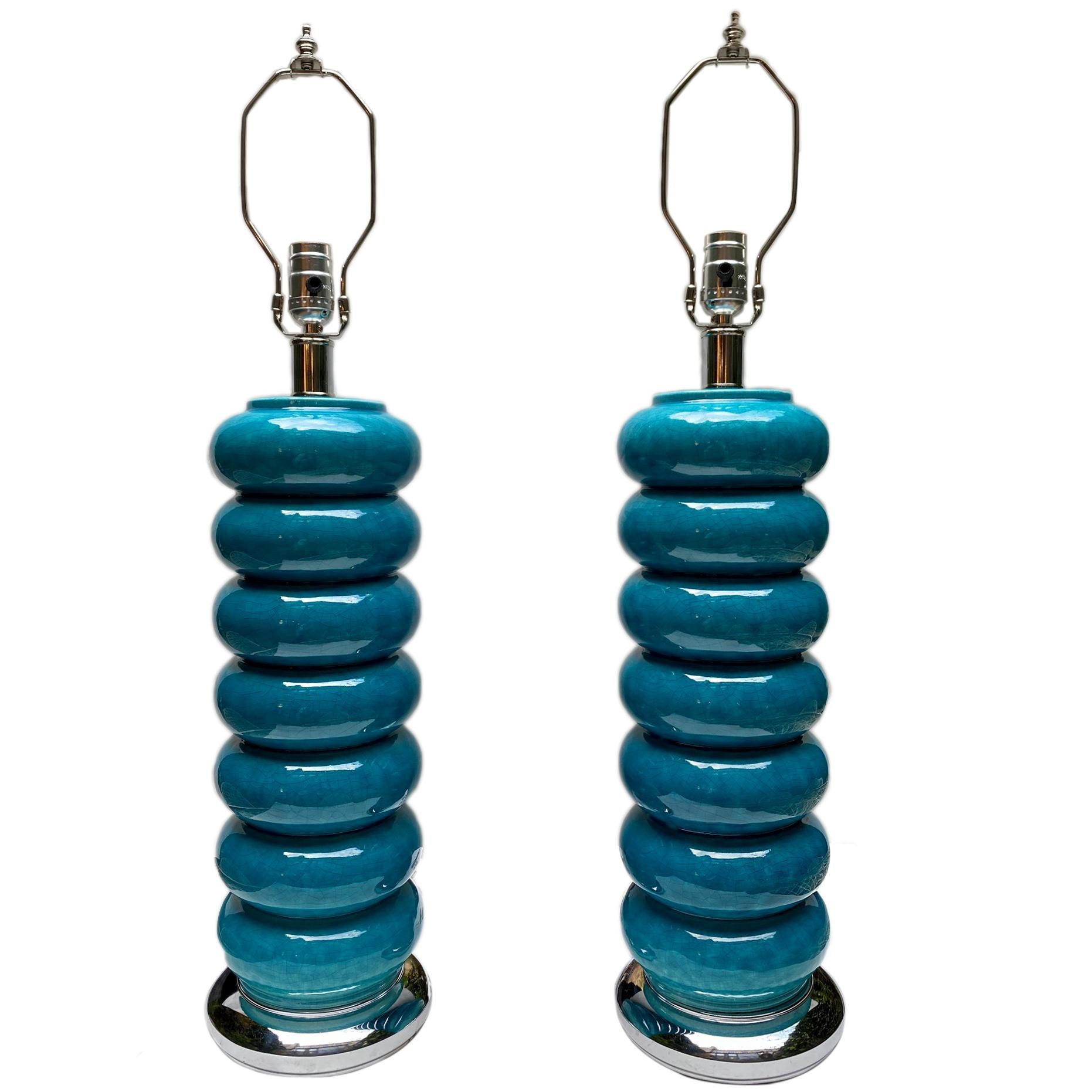 Pair of circa 1960's turquoise porcelain table lamps with nickel plated bases.

Measurements:
Height of body:  19.5