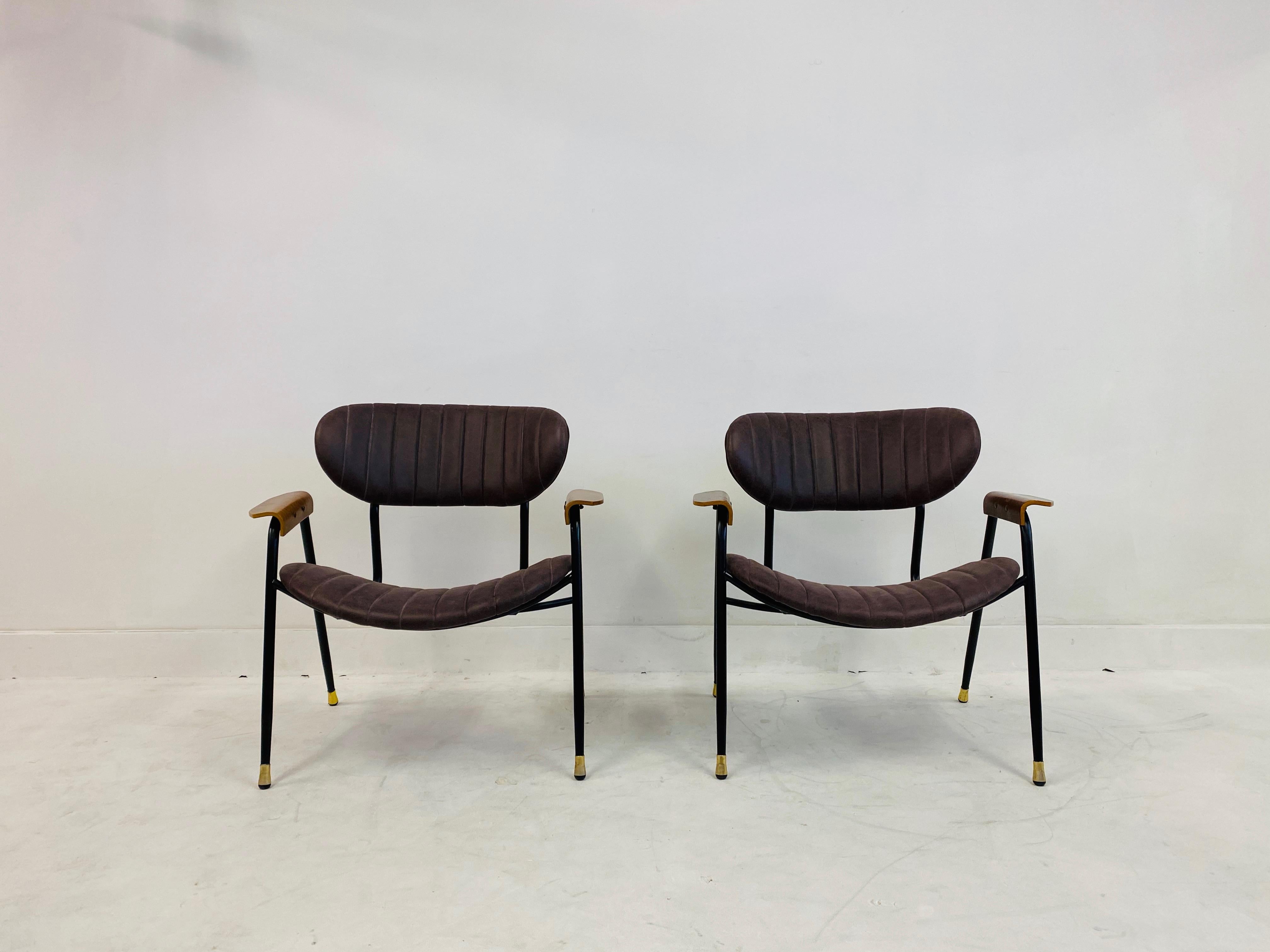 A pair of armchairs by Gastone Rinaldi for RIMA.
New leather upholstery
Refurbished black steel frames.
Gold metal feet
Plywood arm rests.
Italy, 1950s-1960s.