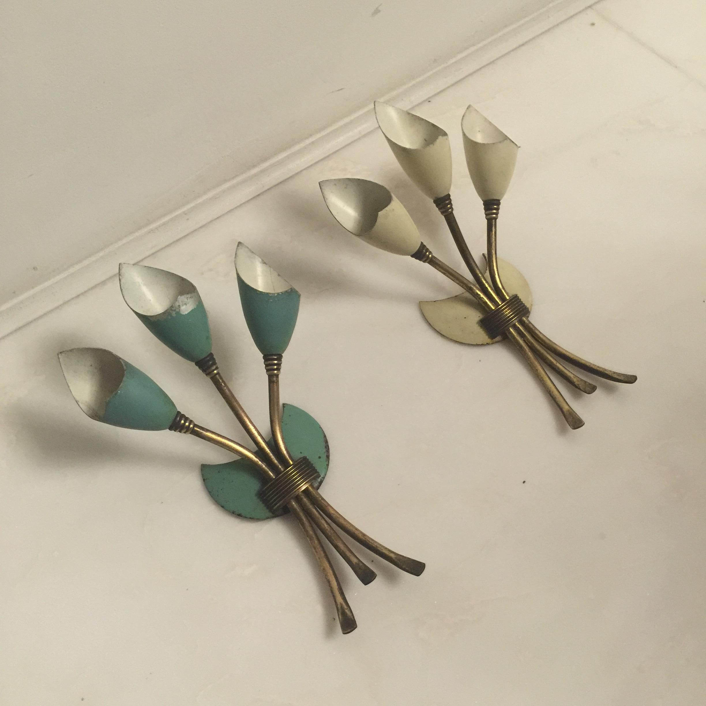 This pair of sconces made from brass and lacquered metal, were produced in Italy during the 1950s in the manner of Arredoluce Monza.
