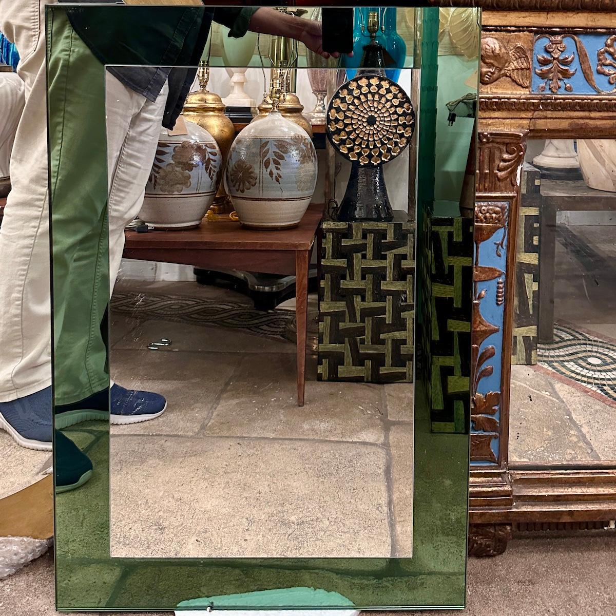 A pair of circa 1960's Italian mirrors with green mirror frame.

Measurements:
Height: 32.5