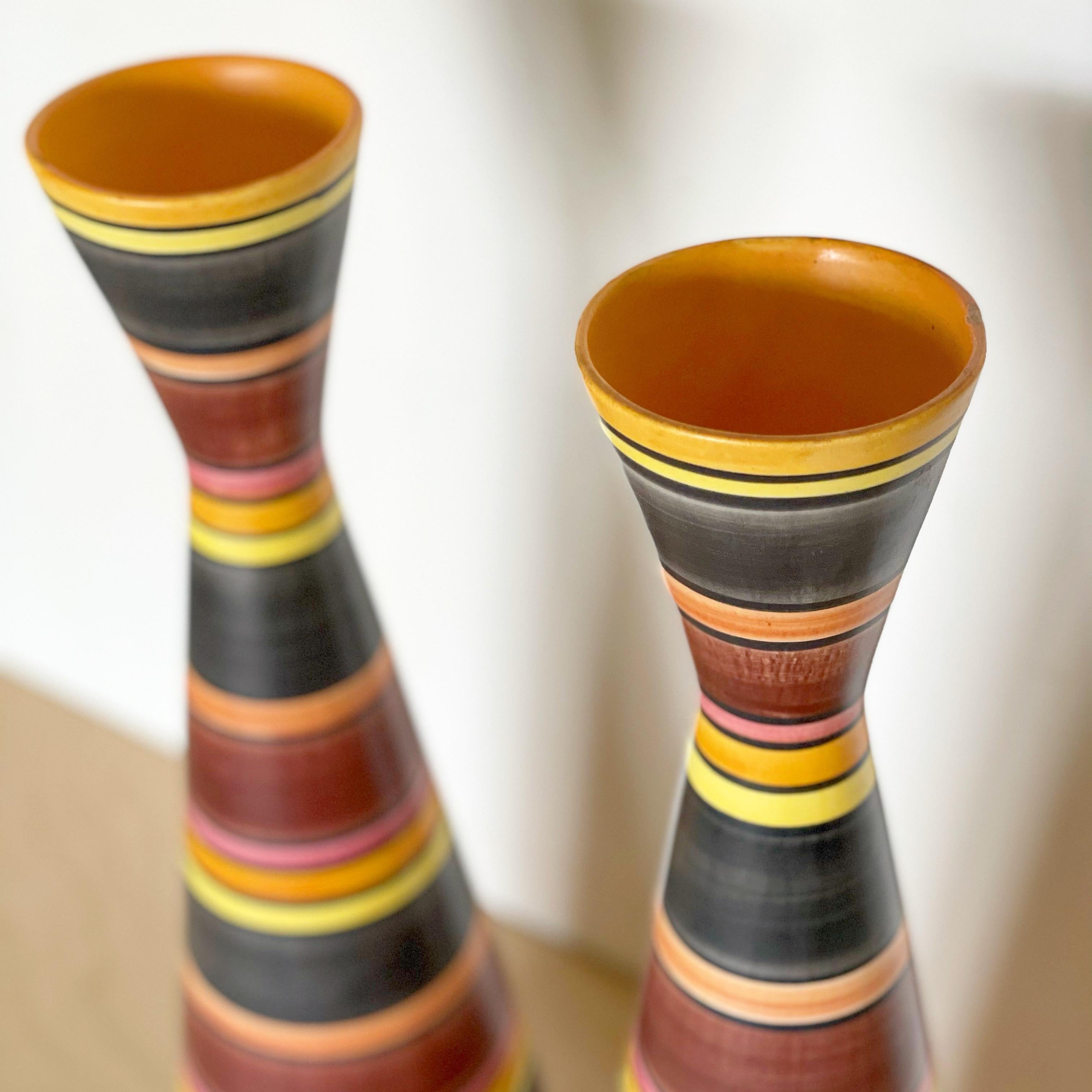 Pair of tall striped Italian modernist vases. Gorgeous form and colors. Shades of yellow, orange, green, red and pink.
Excellent original, unaltered condition.
Measures: D 5
