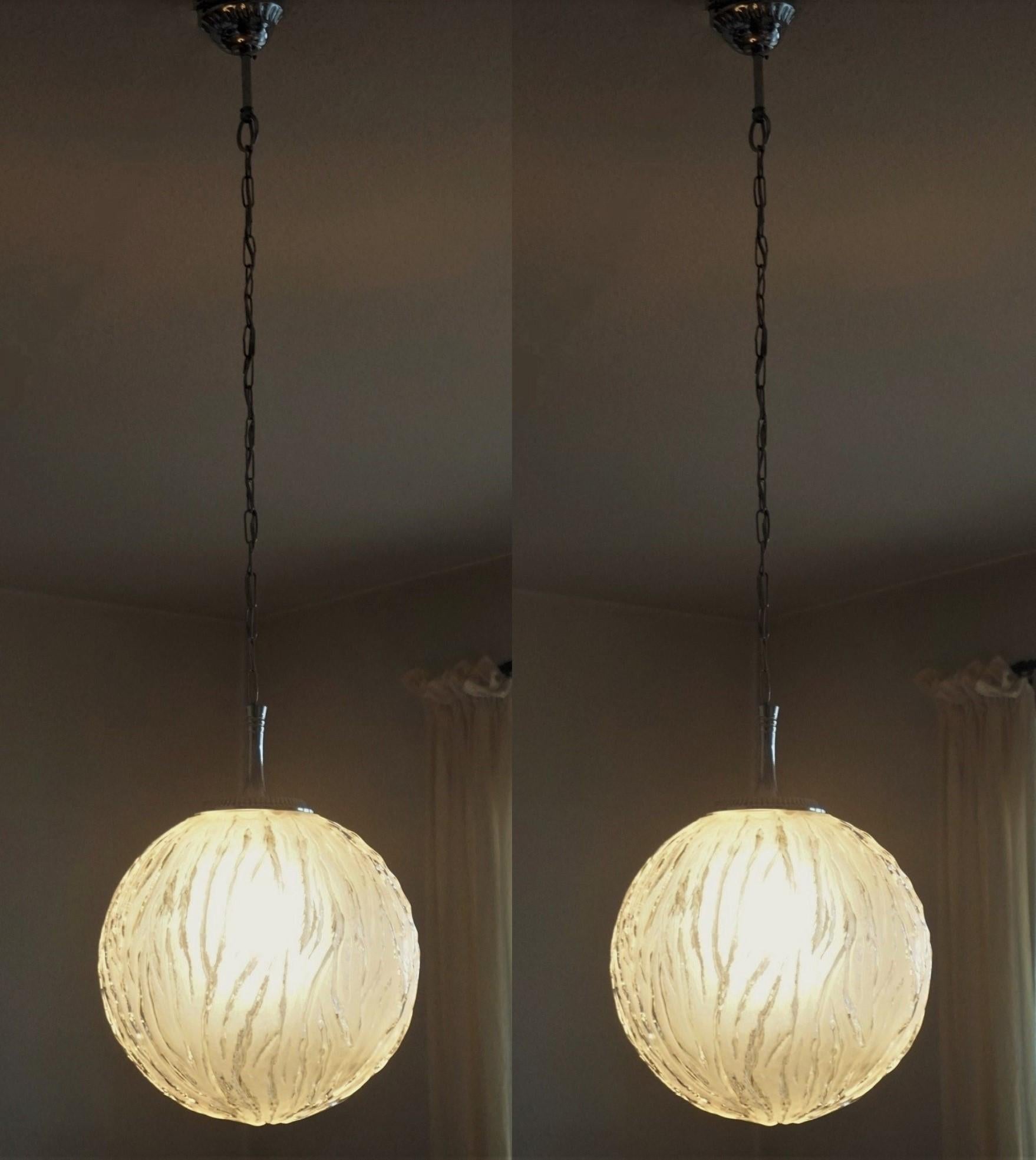 A pair of Art Deco  glass sphere pendants or lanterns with chrome mounts in Degue Style, France, 1950s.
One Edison E27 light socket for a large sized bulb up to 100W
both pendants are in fine condition, rewired.
Measures: Height 45