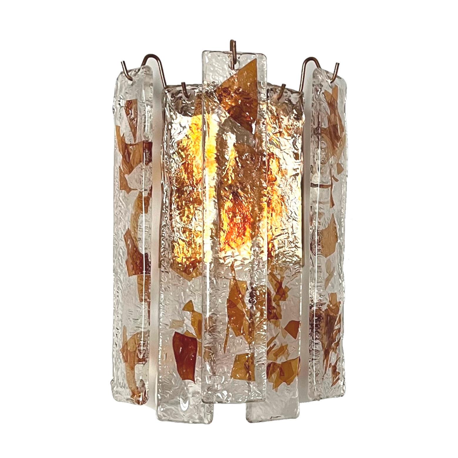 Unique, beautiful and lovely pair of Italian Murano glass wall sconces from 1970s. These fixtures were made during the 1970s in Italy.
Each Sconce is equipped with 1 light socket E27. A professional electrician has checked and prepared the piece to