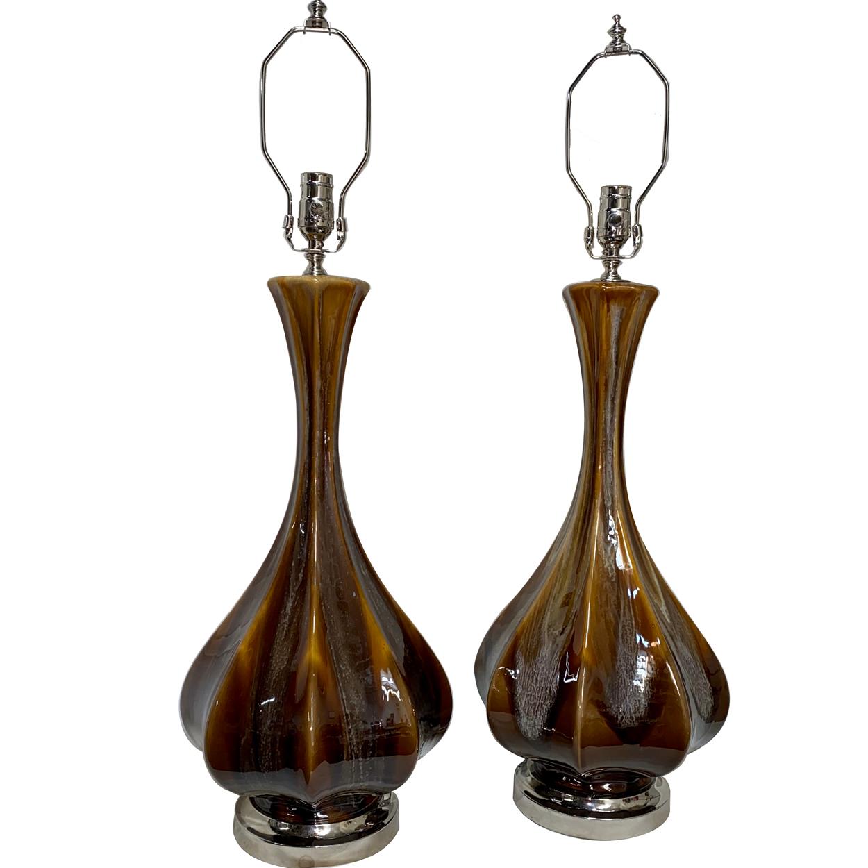 Pair of circa 1960s Italian porcelain table lamps with silver-plated bases.

Measurements:
Height of body: 23