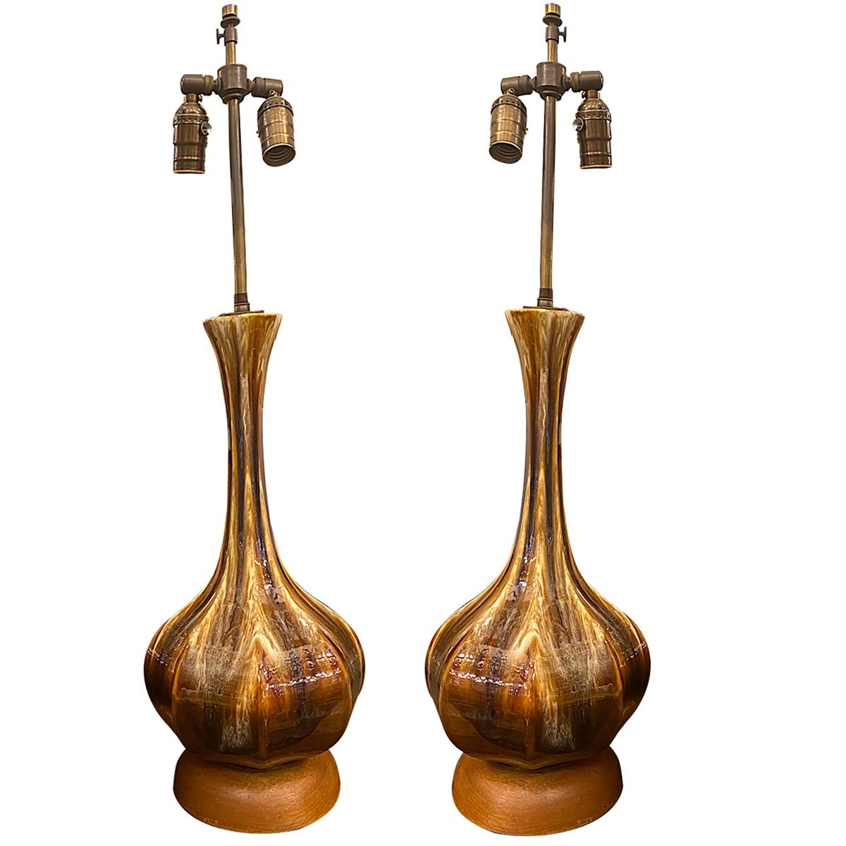 Pair of circa 1960's Italian porcelain table lamps with wooden bases.

Measurements:
Height of body: 20.25
