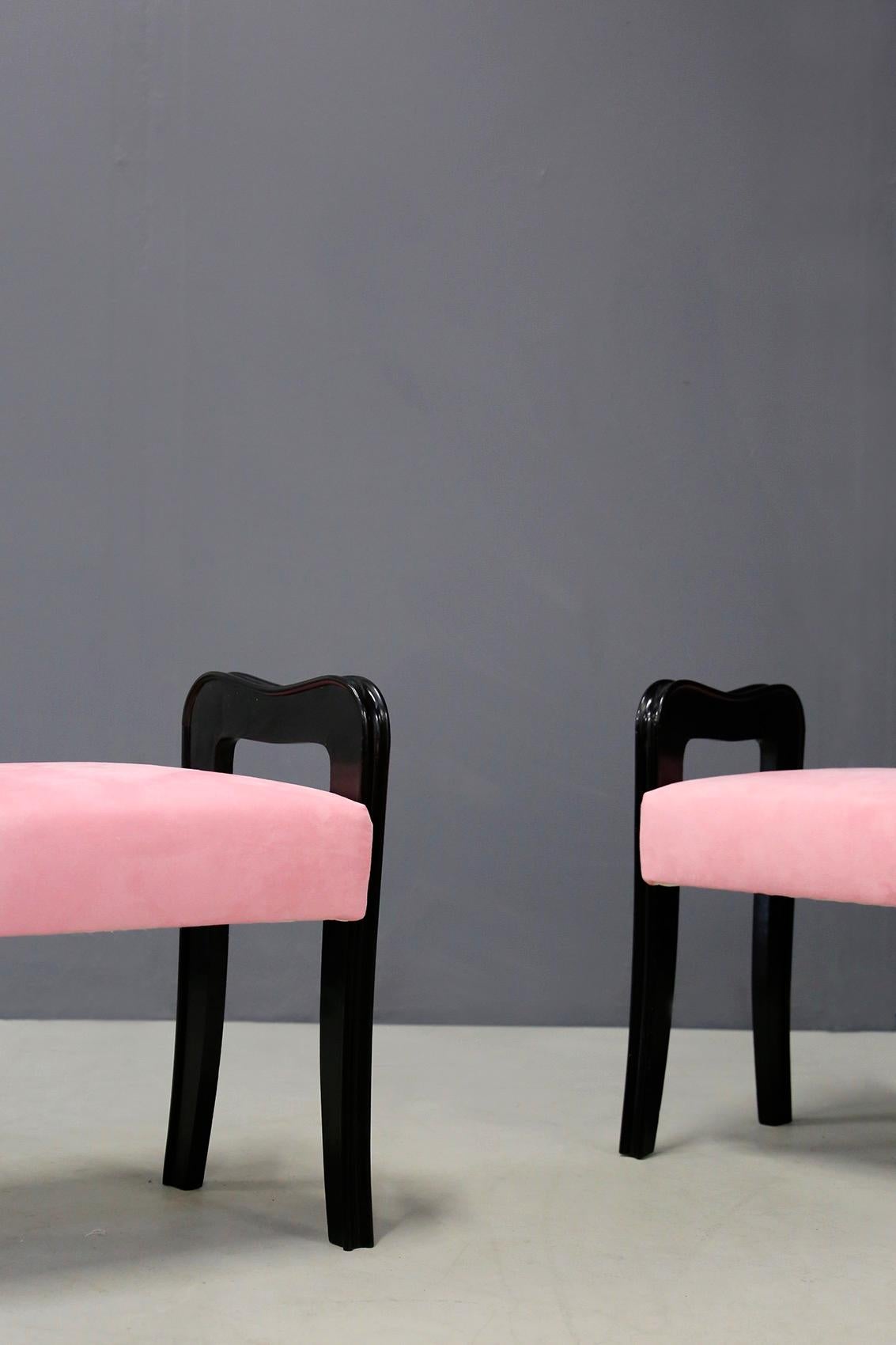 Pair of Italian stools attributed to designer Paolo Buffa from circa 1950. The stools have been restored and lined in pink velvet. The pair is made of ebonized wood and has slight defects due to age and use. The peculiarity of the product are its