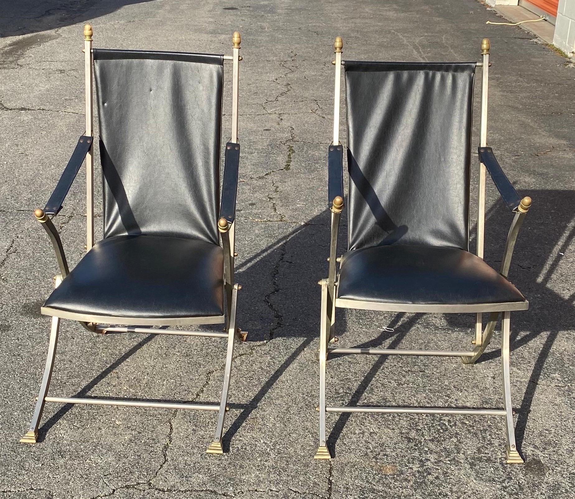 Pair of midcentury Jansen style steel and leather folding campaign chairs.