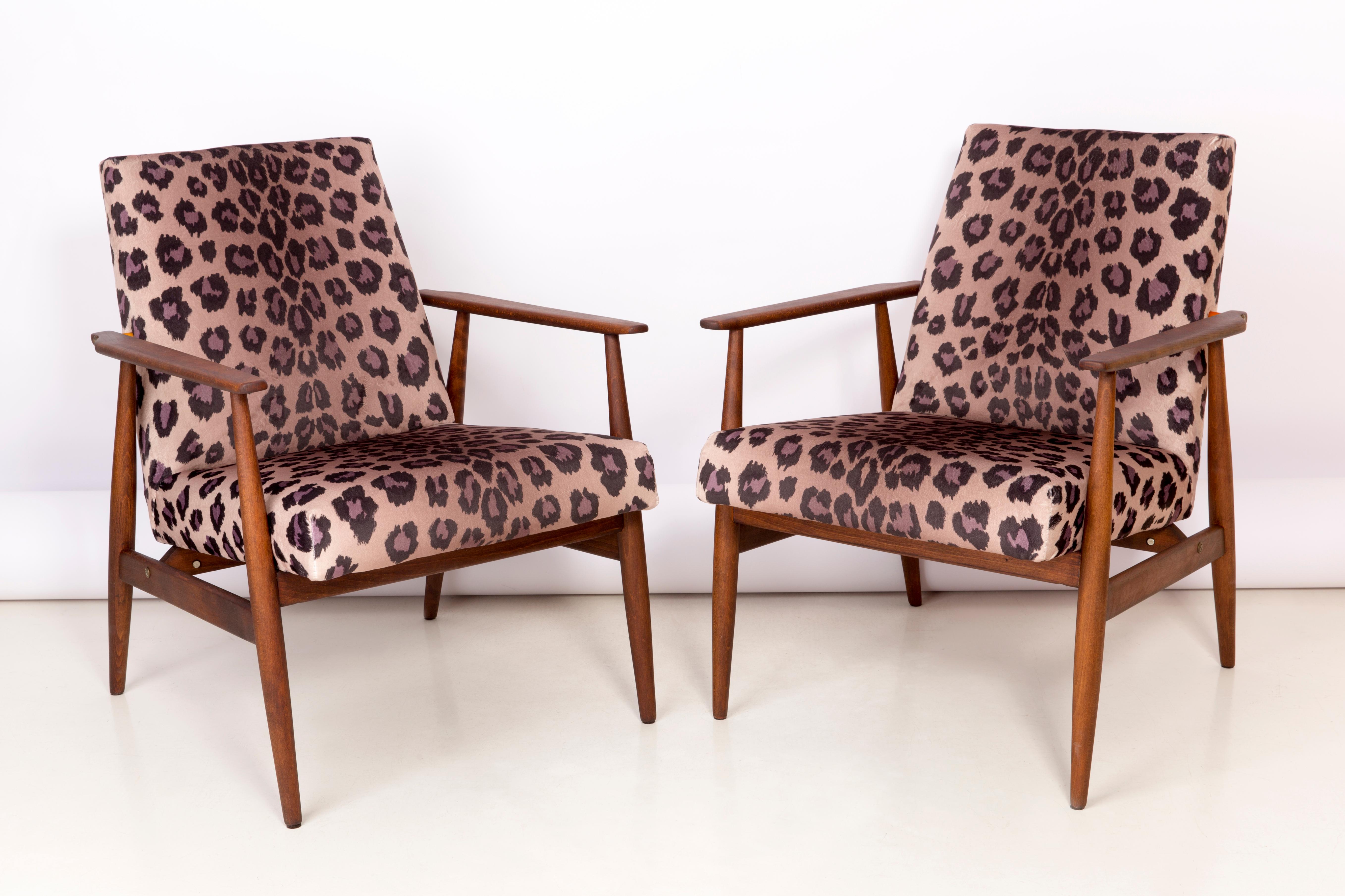 A beautiful, restored armchairs designed by Henryk Lis. Furniture after full carpentry and upholstery renovation. The fabric, which is covered with a backrest and a seat, is a high-quality italian velvet upholstery printed in leopard pattern. The