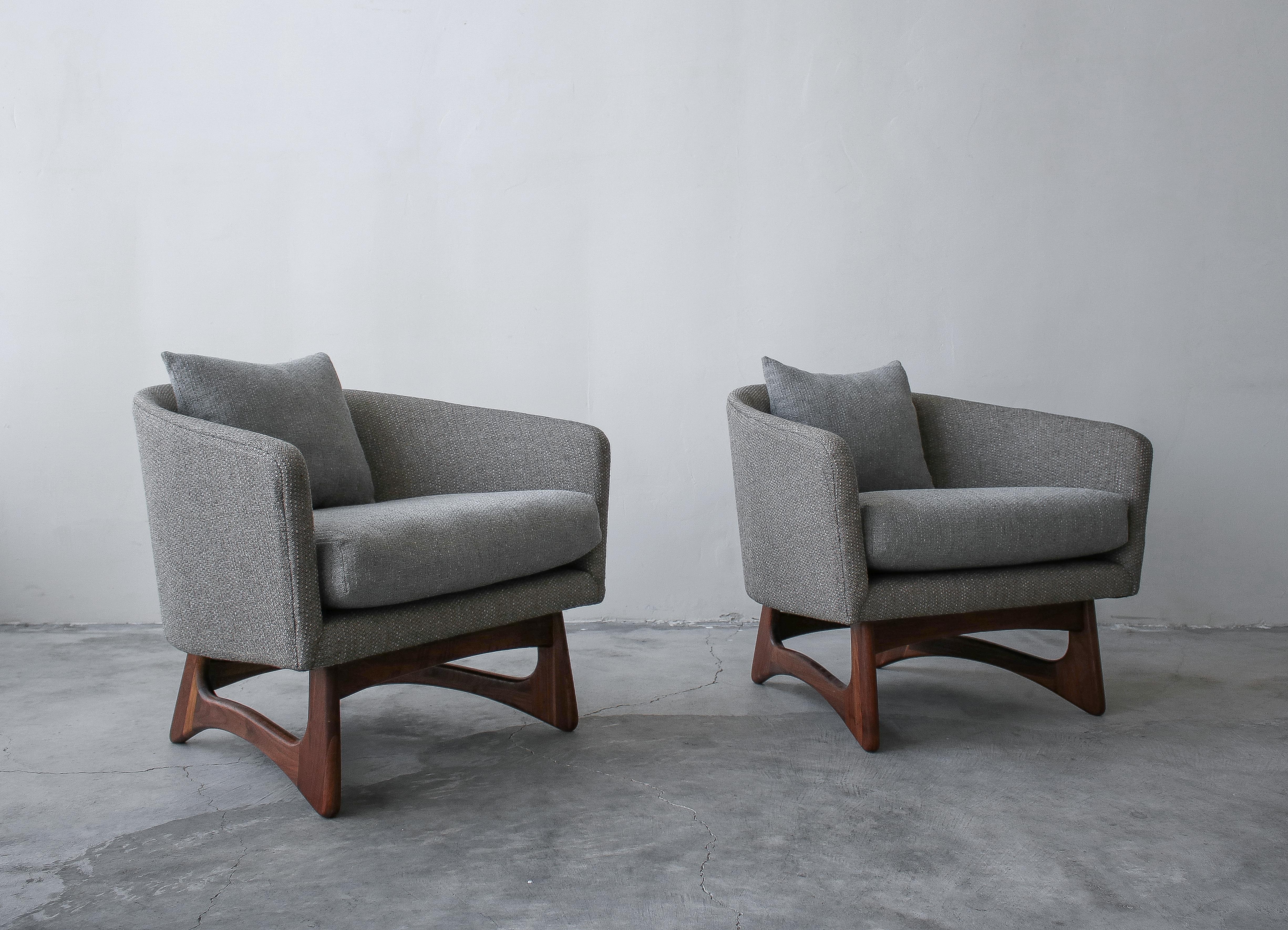 Rare pair of midcentury lounge chairs by Adrian Pearsall. These chairs have beautiful barrel shape and sculpted walnut bases. Chairs are substantial in size, pictures do not do them justice.

Chairs have been professionally reupholstered with all