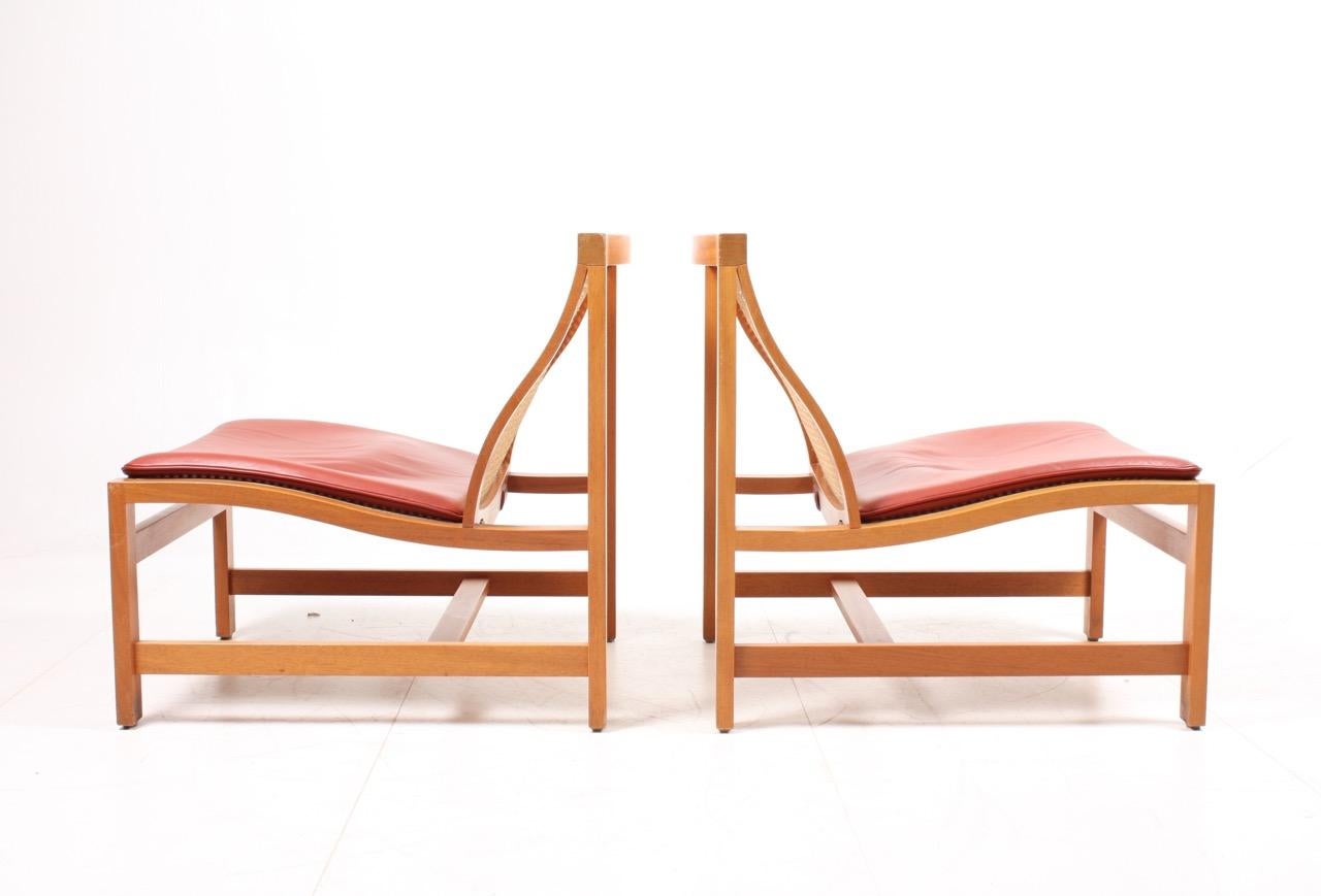 Scandinavian Modern Pair of Midcentury Lounge Chairs by in Beech and Patinated Leather, Danish