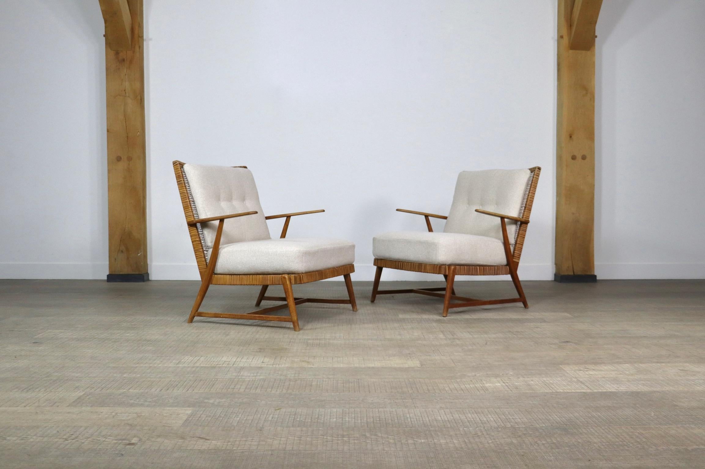 Bouclé Pair of Midcentury lounge chairs in oak and cane, Germany, 1950s