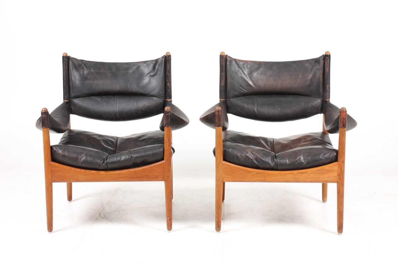 Danish Pair of Midcentury Lounge Chairs in Oak and Patinated Leather, Denmark, 1960s