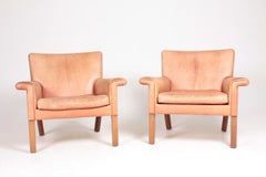 Pair of Midcentury Lounge Chairs in Patinated Leather by Hans Wegner, 1960s