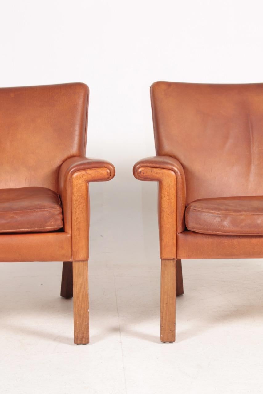 Pair of Midcentury Lounge Chairs in Patinated Leather by Hans Wegner, 1960s 1