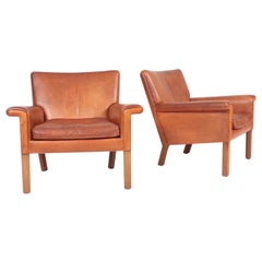 Pair of Midcentury Lounge Chairs in Patinated Leather by Hans Wegner, 1960s