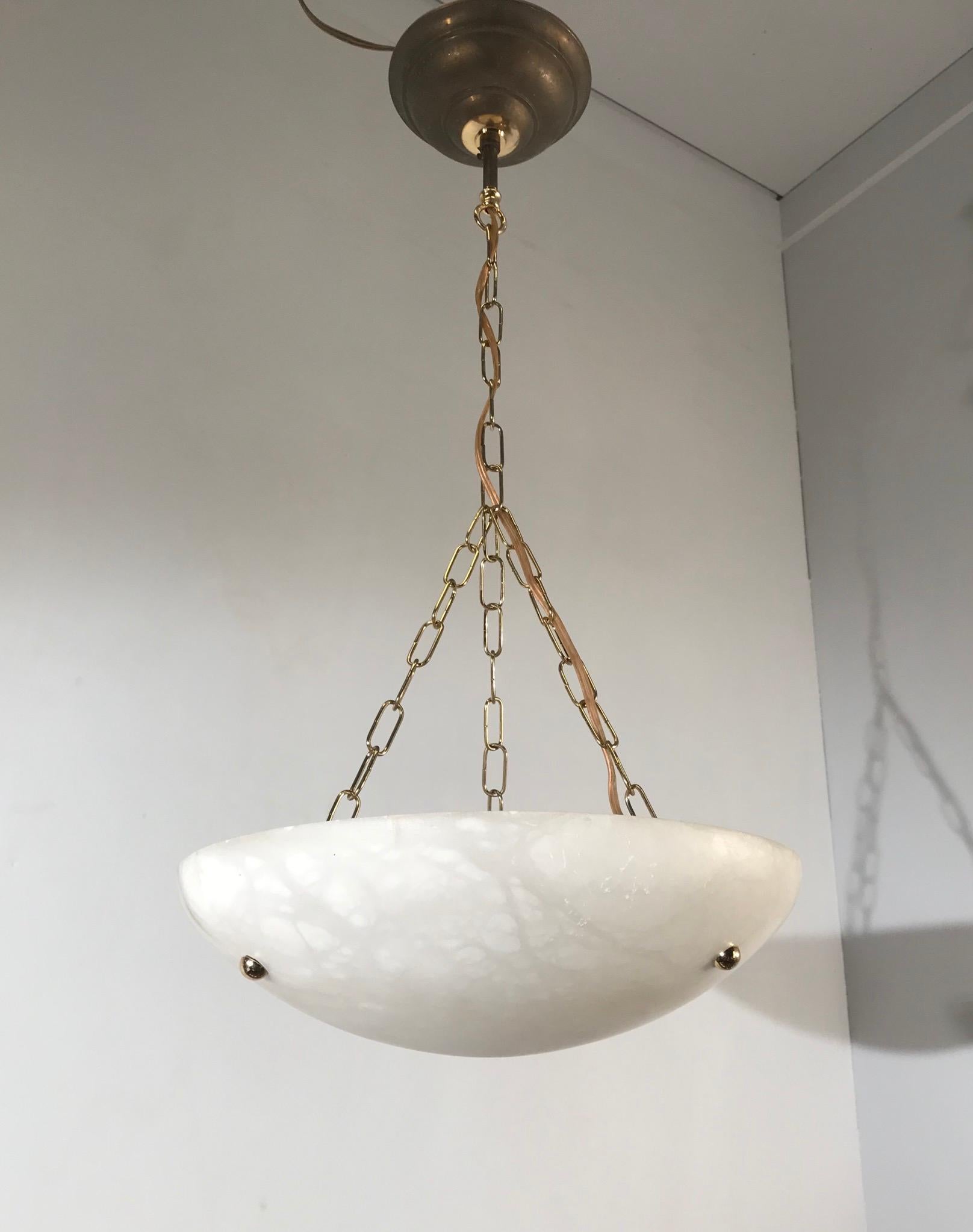 A set of two beautifully shaped mineral stone pendants.

If you are looking for a fine and practical size pair of Art Deco style light fixtures then these two could be perfect for you. These pendants are beautiful to look at, both on and off and the