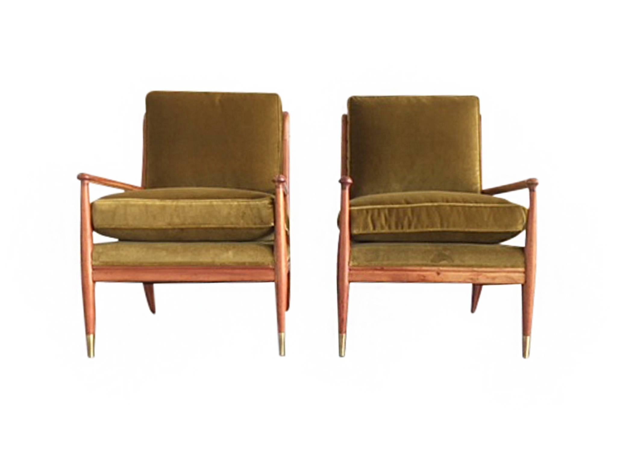 These comfortable Mid-20th Century lounge chairs were designed by John Stuart and manufactured by Widdicomb. They are exquisitely crafted from maple wood with a new, warm mahogany finish. Stuart's design is one of openness and clean lines that are