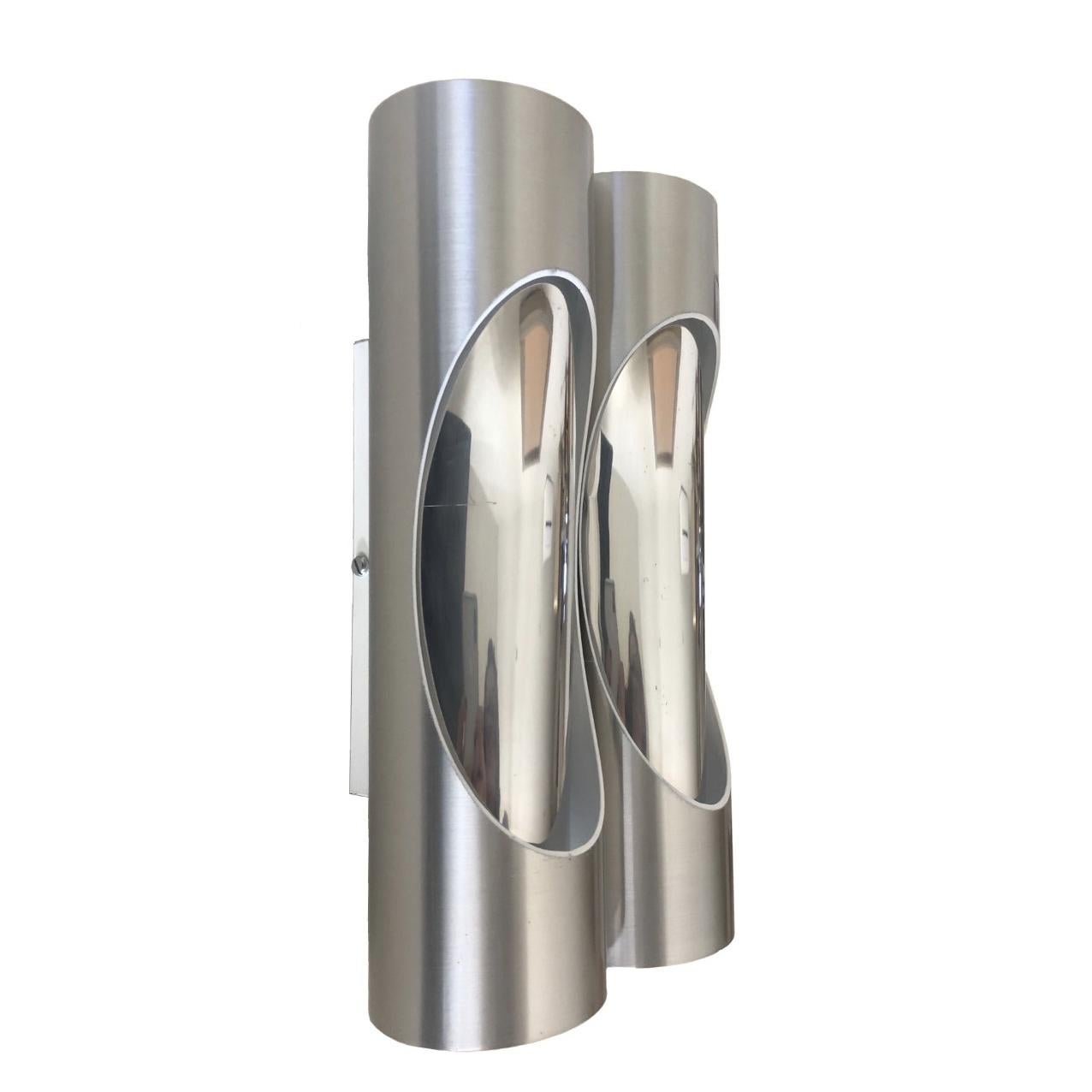 Stunning and beautiful pair of mid century silver tubular double Spanish wall sconces. These wall sconces are made in Barcelona (Spain) by Marca, S.L., during 1980s.
Each wall sconce is equipped with 4 light sockets (E27). A professional