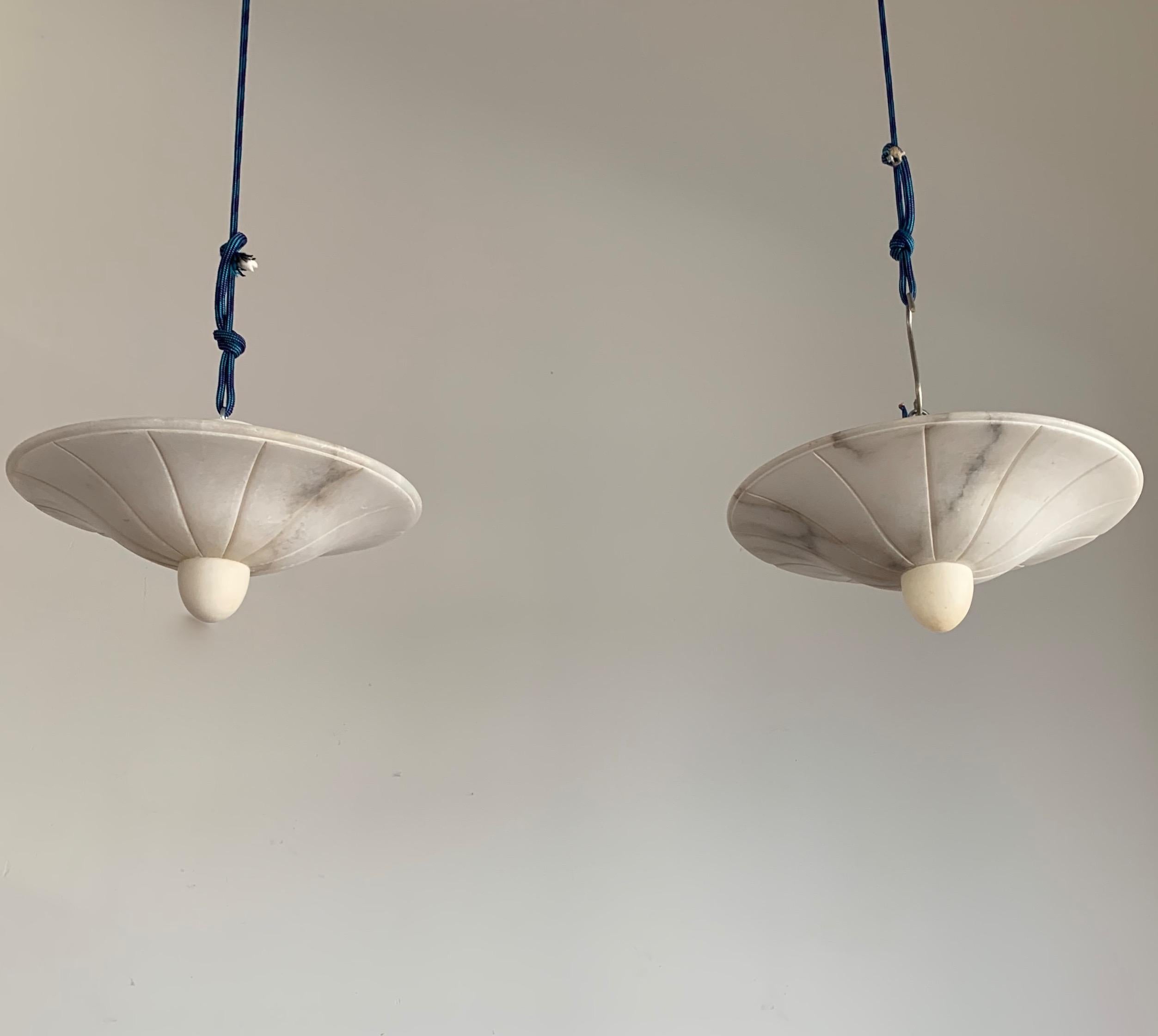 Very rare design and good size alabaster flush mounts.

This identical pair of excellent quality and superb condition flush mounts could be your perfect lighting solution. This is the first time that we have ever seen this striking design and for