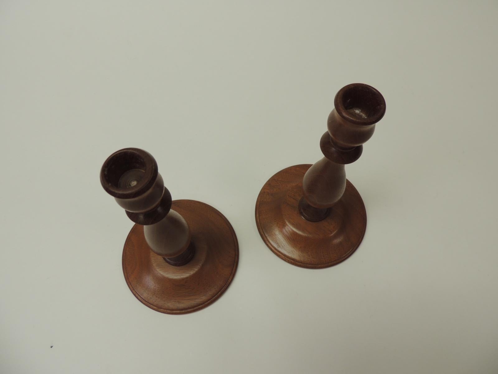 Pair of Mid-Century Modern round mahogany candle holders.
Candlestick holder signed J W 1999.
Size: 4.5 Base x 8 H.