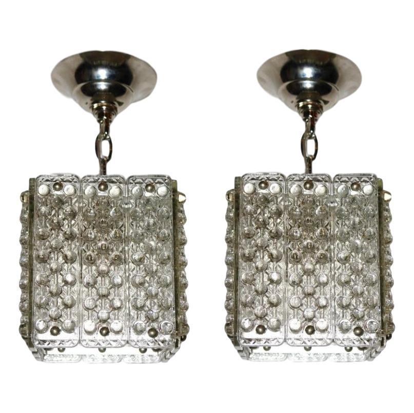 A pair of Italian circa 1960s molded glass pendant/lanterns with interior light. Sold individually.

Measurements:
Height of body 11