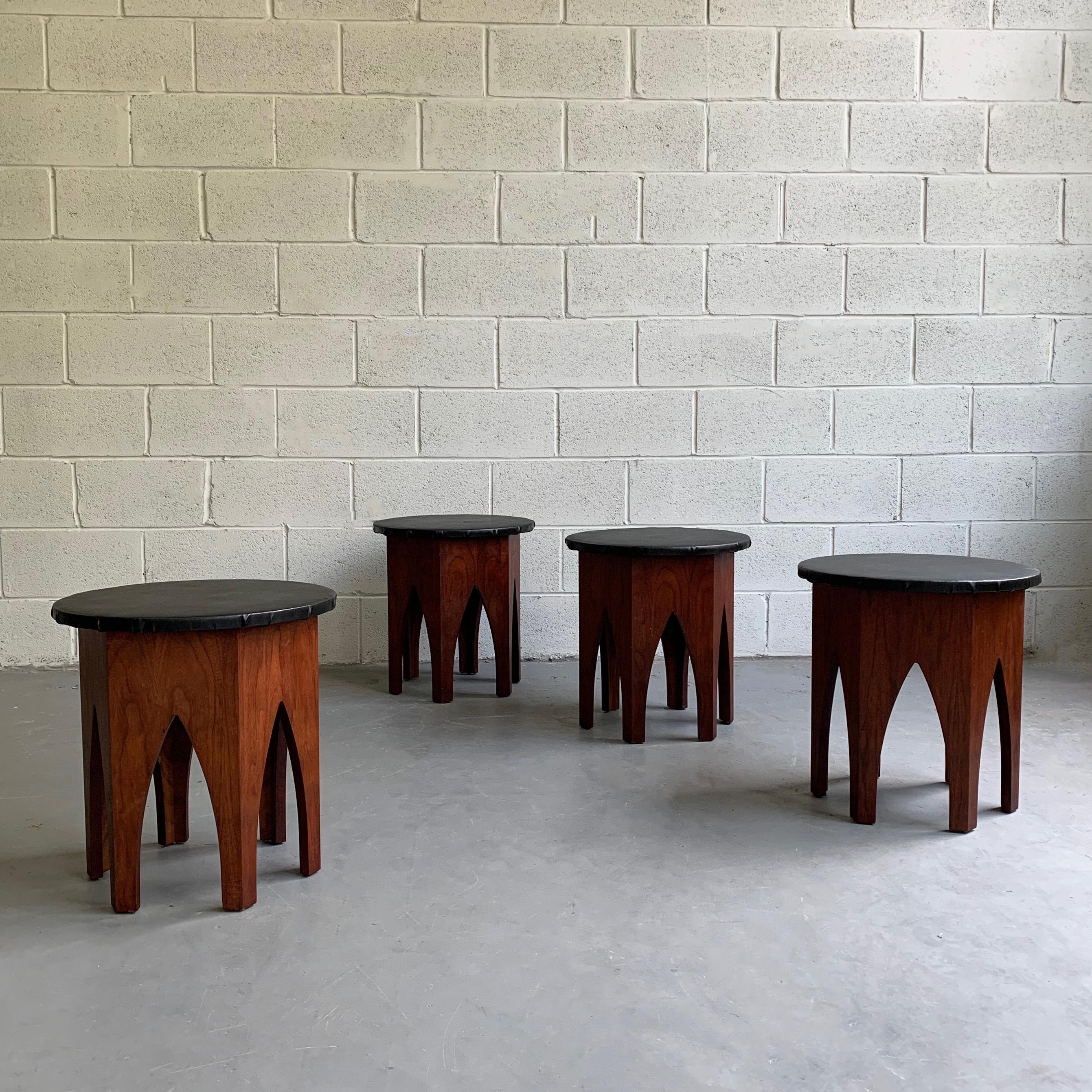 Pair of midcentury, Moroccan influenced stools or side tables in the manner of Harvey Probber feature hexagonal, walnut bases and black vinyl tops. The tops can be replaced with a flat surface to use as side tables. One pair is available.