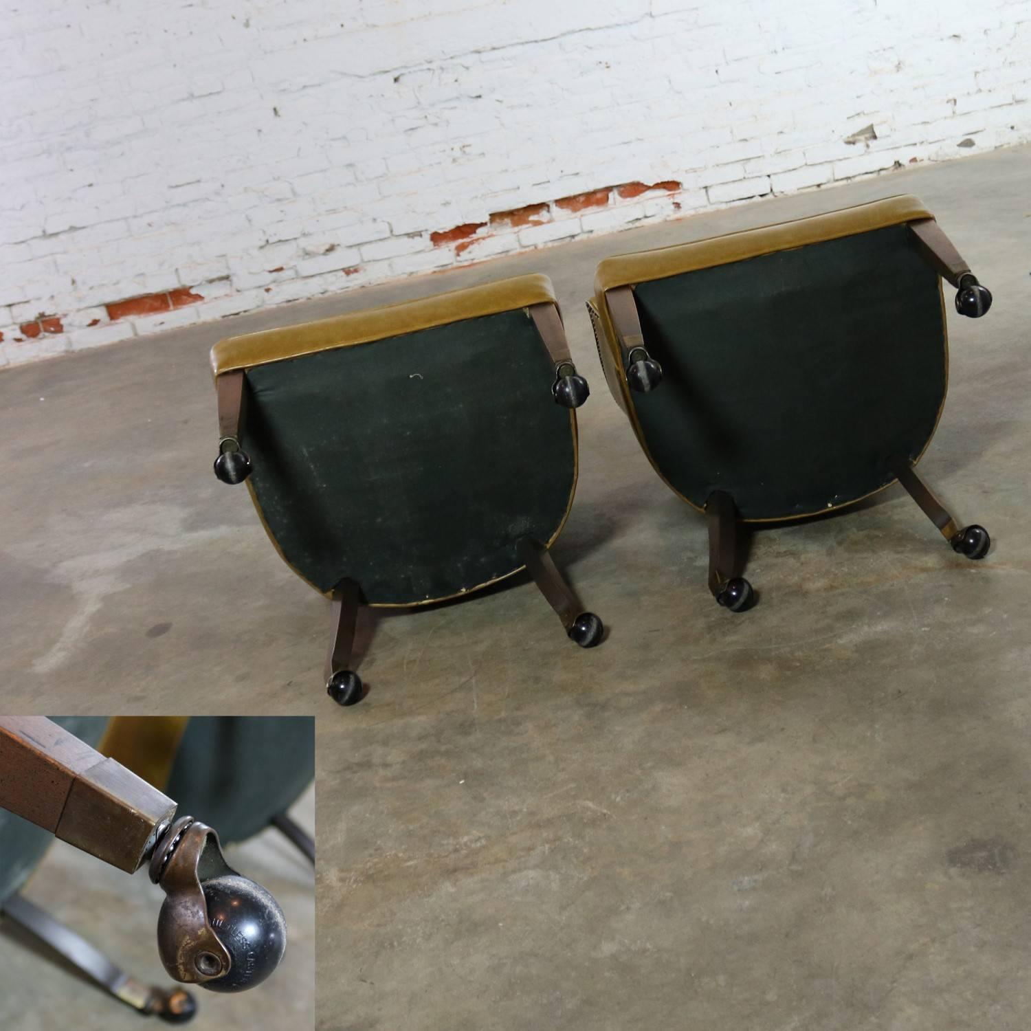 Pair of Midcentury Naugahyde Olive Green Rolling Barrel Chairs Nail Head Accent In Good Condition In Topeka, KS