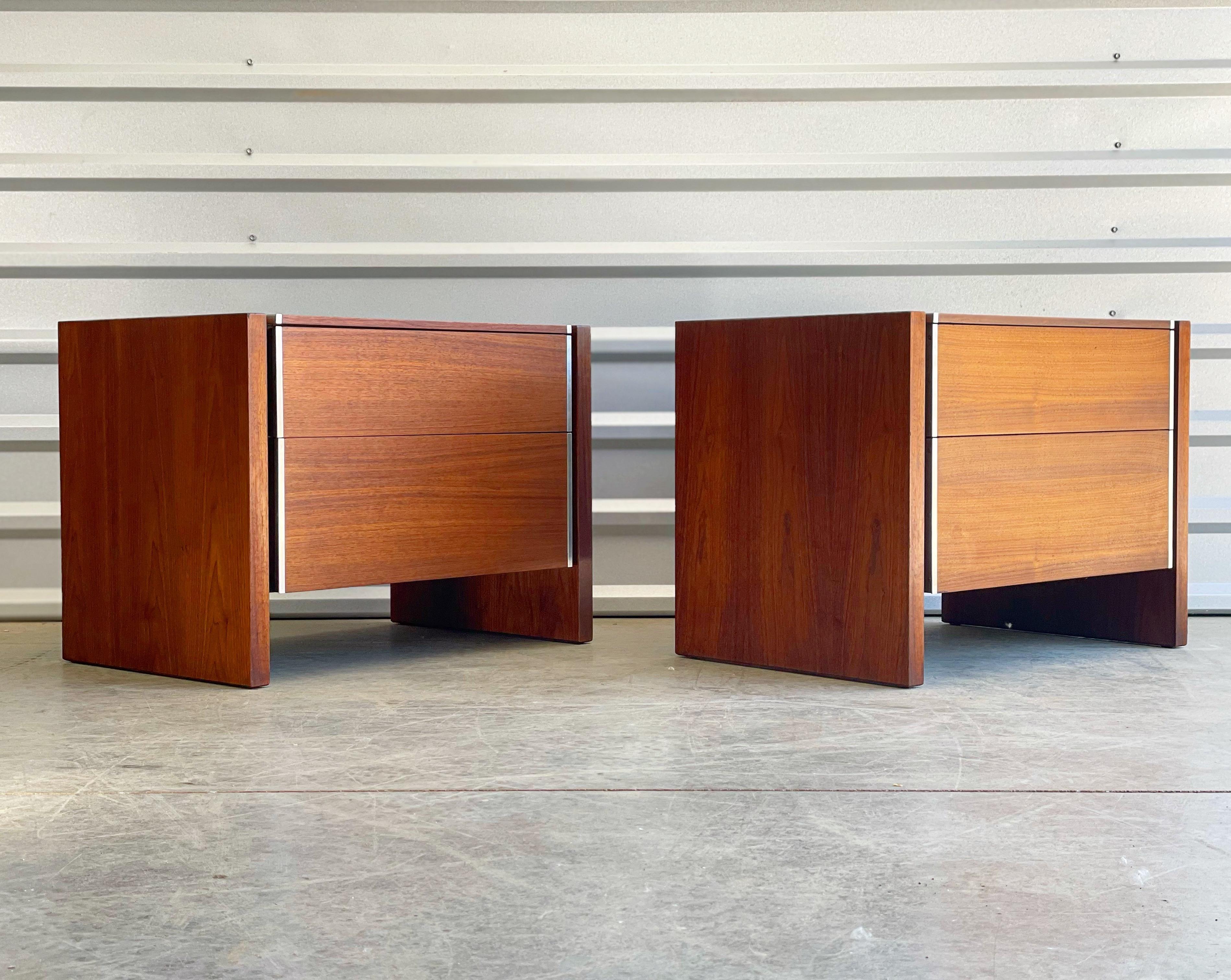Pair of Mid-Century Modern night stands by Robert Baron in walnut and aluminum. Produced by Glenn of California and distributed and sold by John Stuart. Quality American design and craftsmanship. Minimalist design. Excellent original condition. No