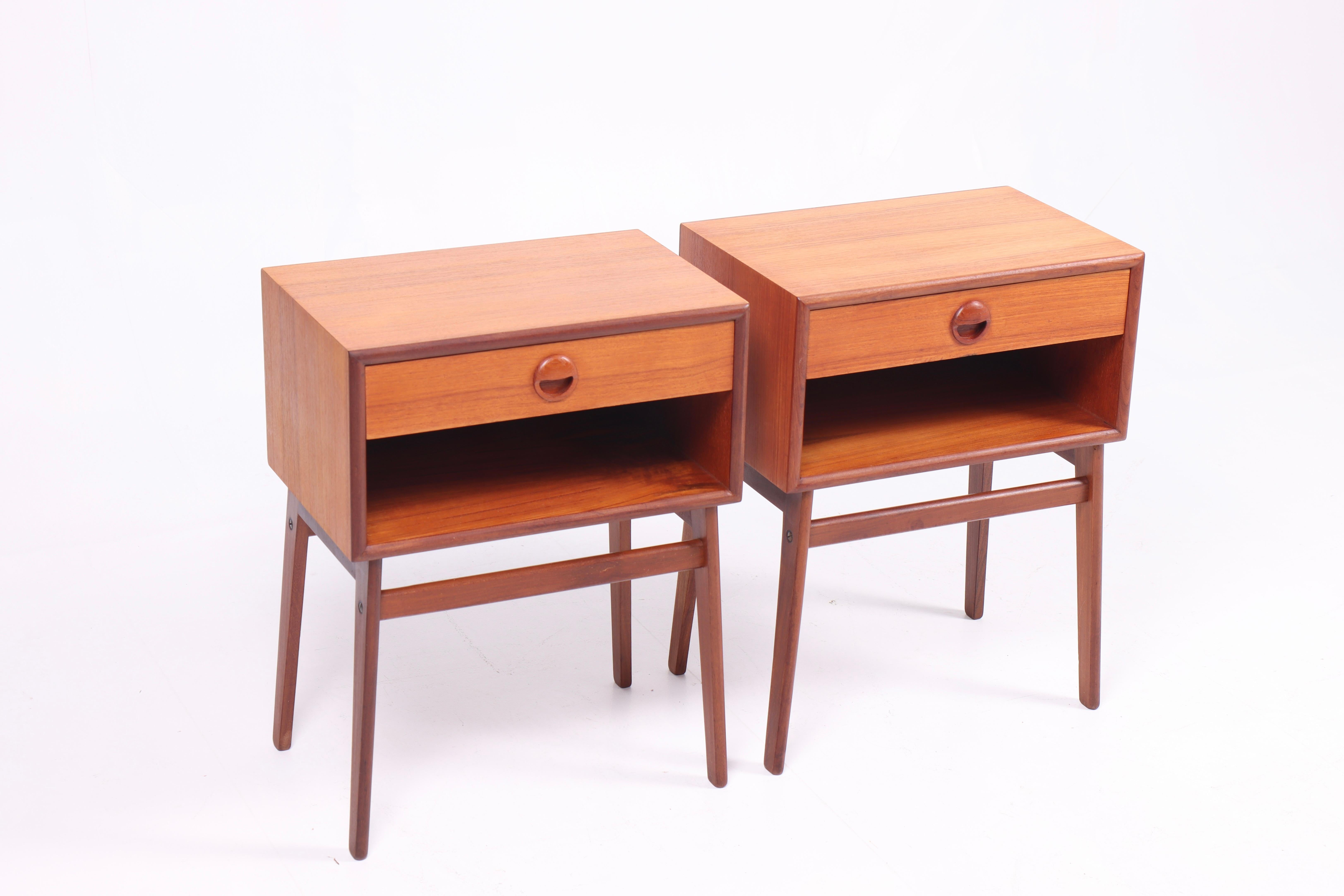 Pair of nightstands in teak, designed and made in Denmark 1960s. Great original condition. 