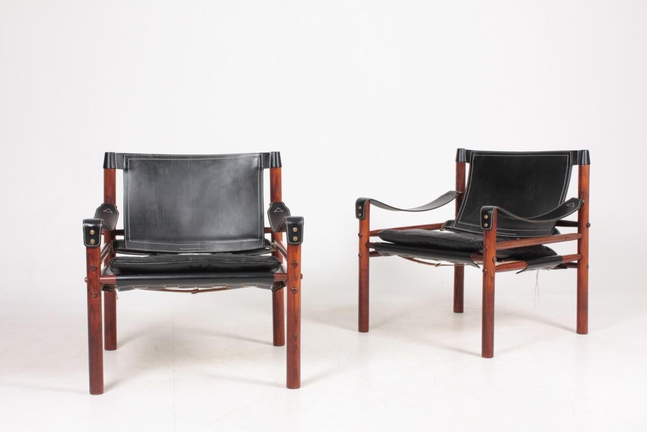 Pair of Scirocco safari chairs designed by Arne Norell for Norell Möbel, AB in 1964. Made in Sweden, great original condition.