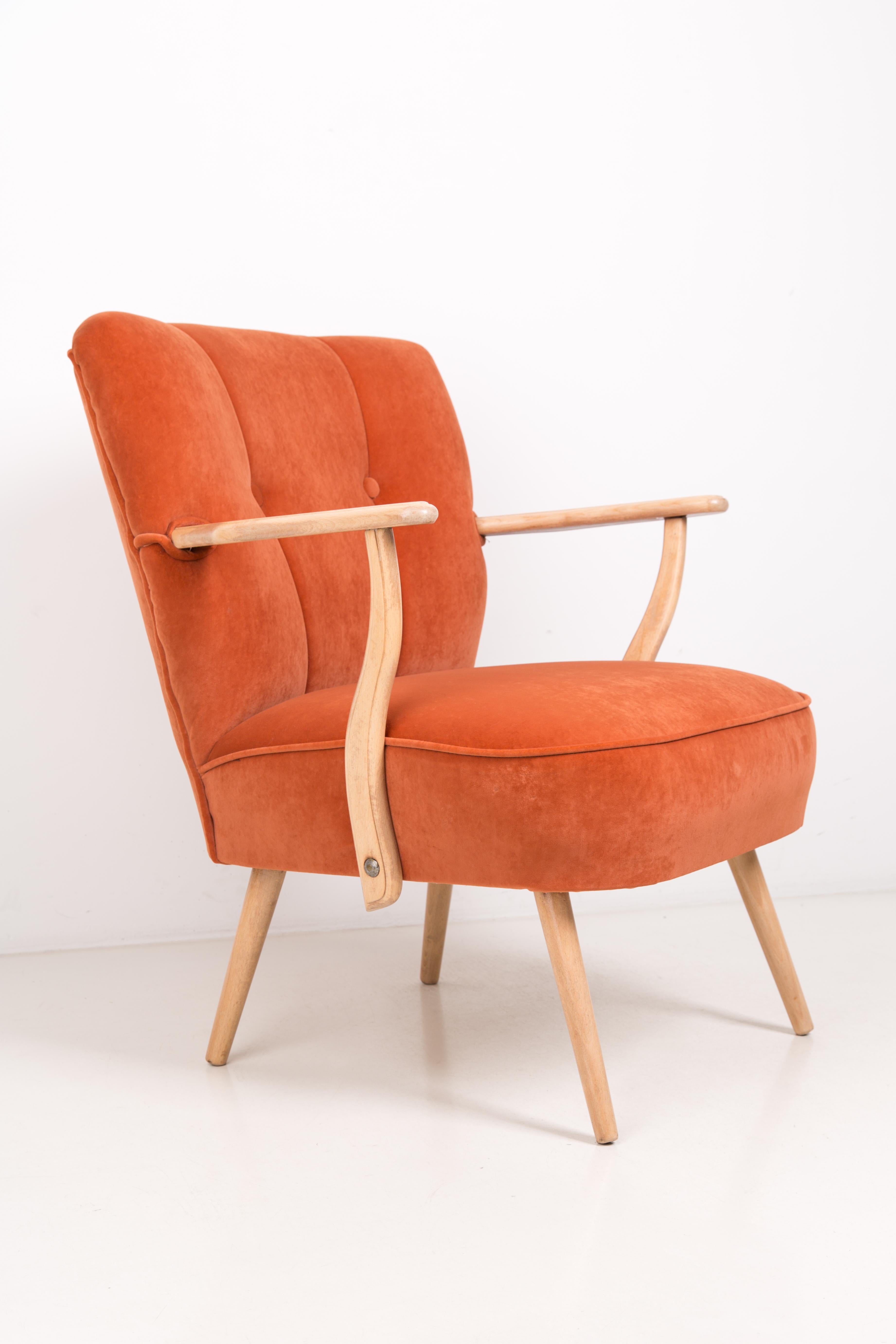 The armchairs with very comfortable, spring seats. Produced in 1960s in Germany. The armrests are made of beechwood, thoroughly cleaned and finished with matte varnish. The upholstery that the seat has been trimmed is high quality made of
