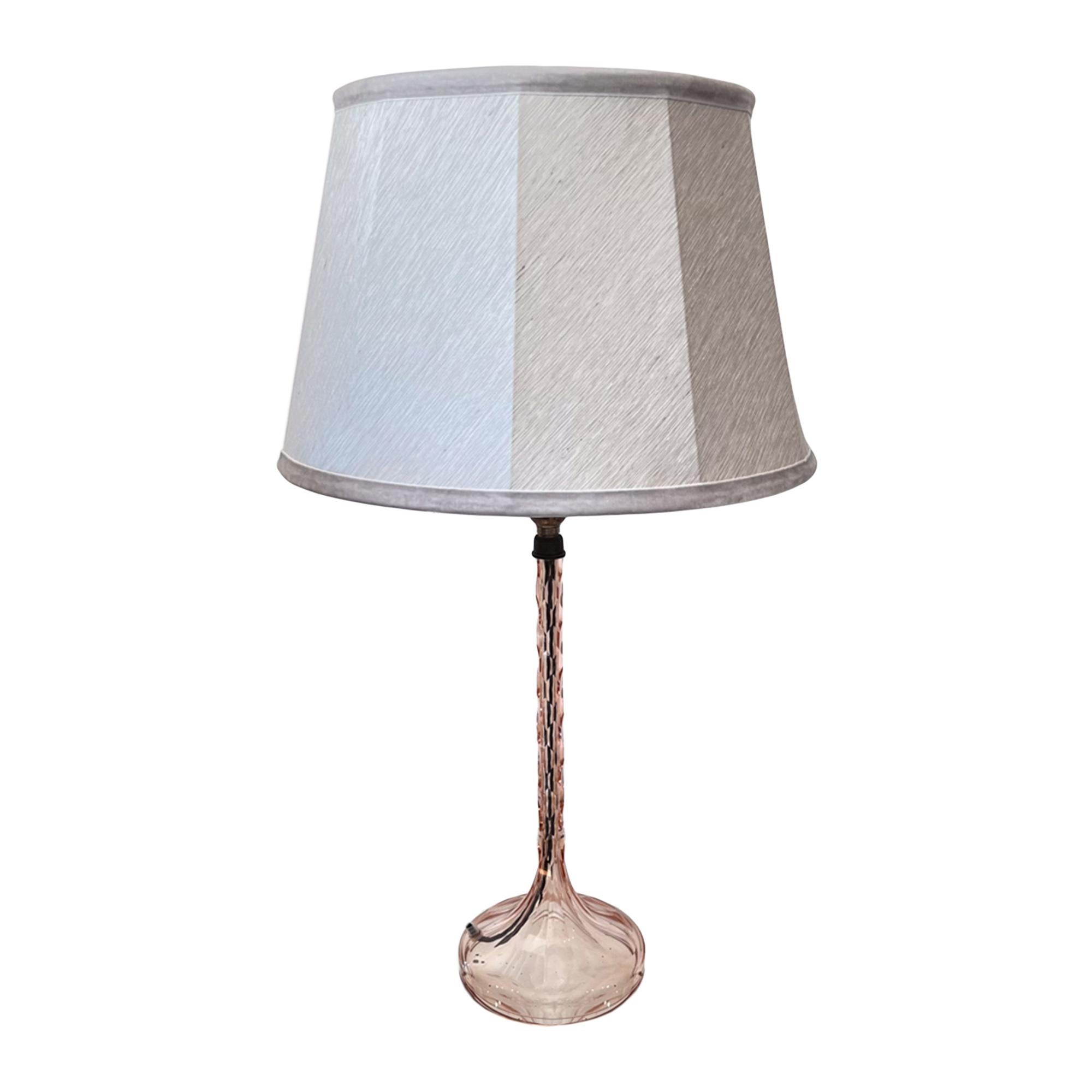 This pair of pretty pink cut glass table lamps were made in France in the 1960s.

We've had them rewired with black twisted flex for the UK, but they can be adapted for any destination - please ask for more details. 

The height of 42cm is to the