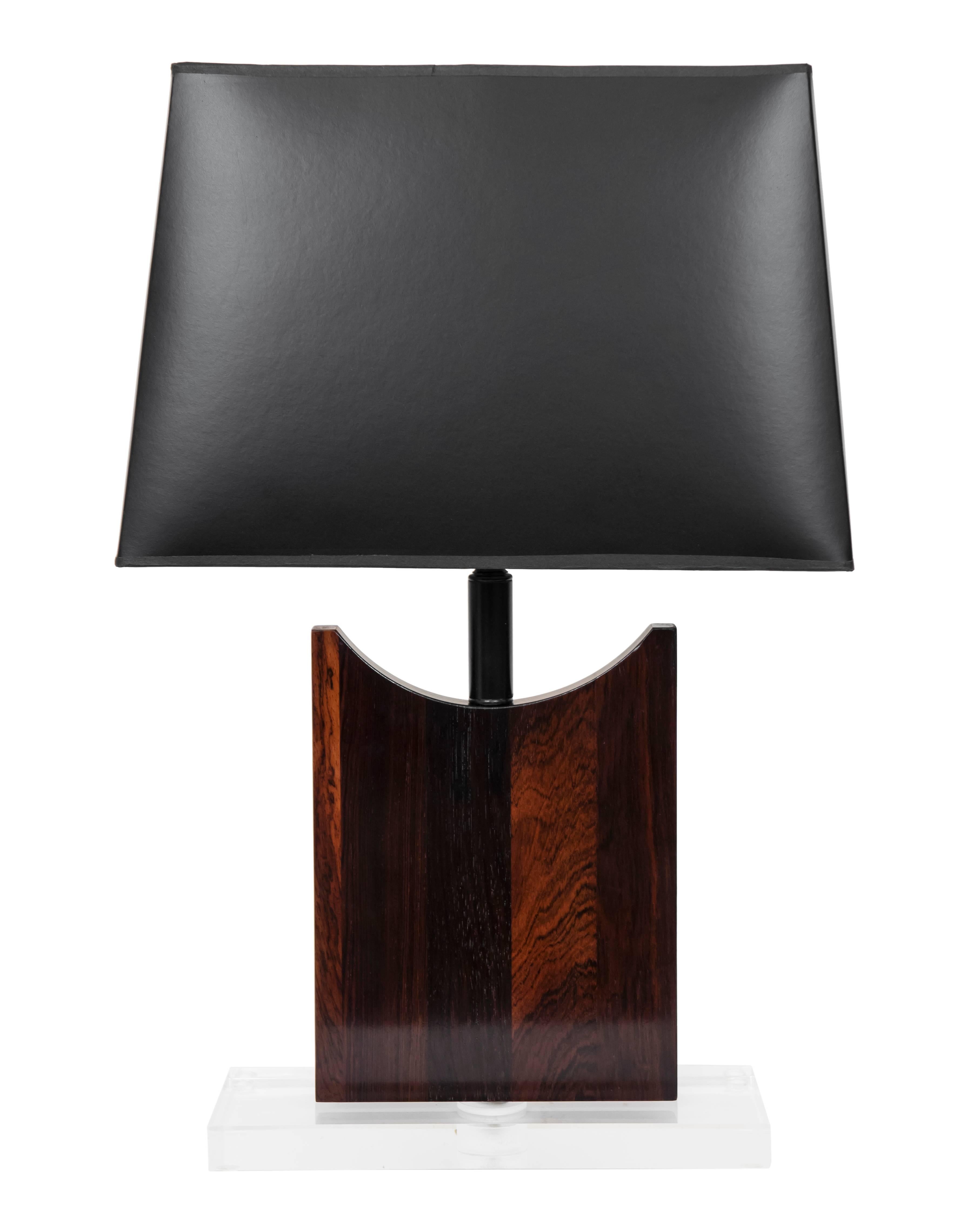 A rich and special pair of custom designed lamps made from vintage wood bases mounted to a Lucite base.
New wiring, socket and black shades. White shades also an option.