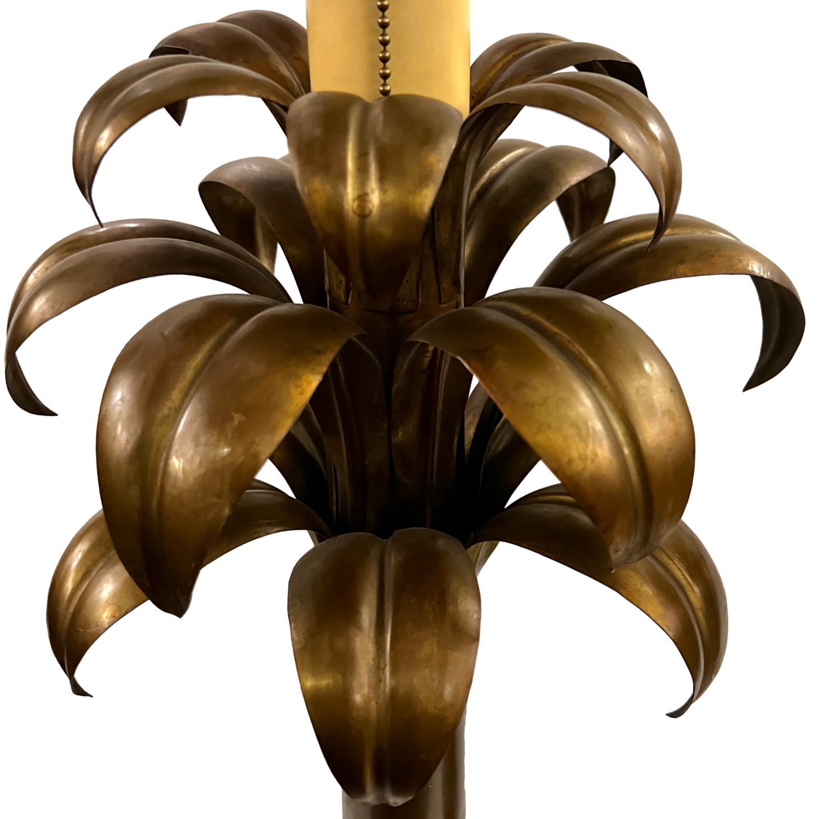 A pair of circa 1950's Italian patinated brass palm tree shaped lamps.

Measurements:
Height of body: 27