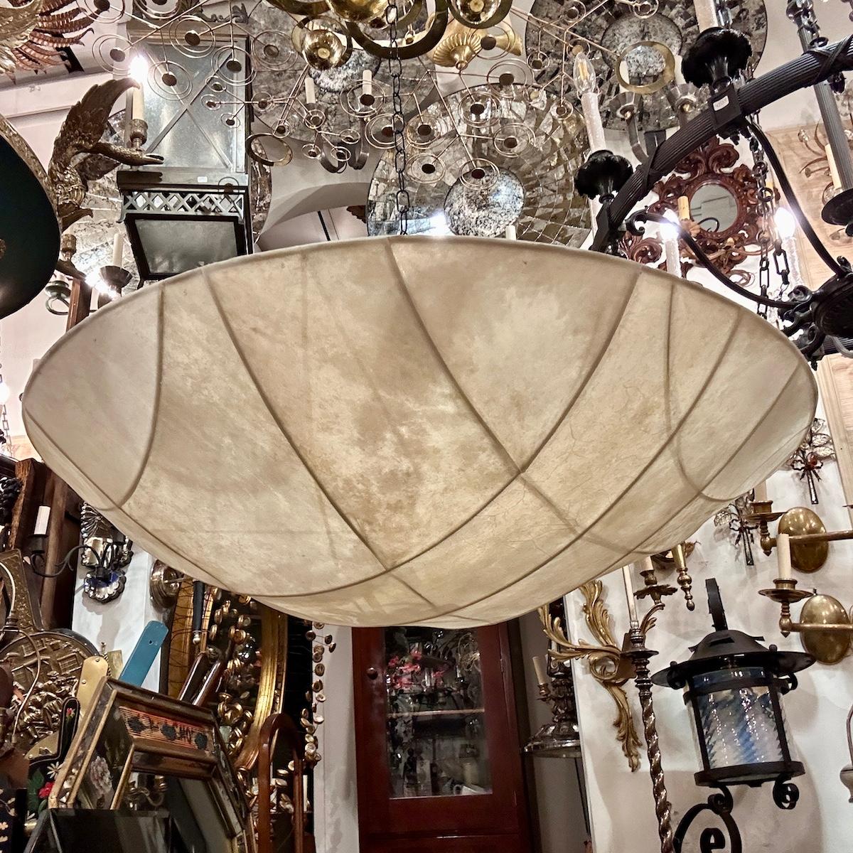 Pair of circa 1960's Italian Modernist parchment light fixtures with 6 interior Edison lights. Sold individually.

Measurements:
Drop: 18