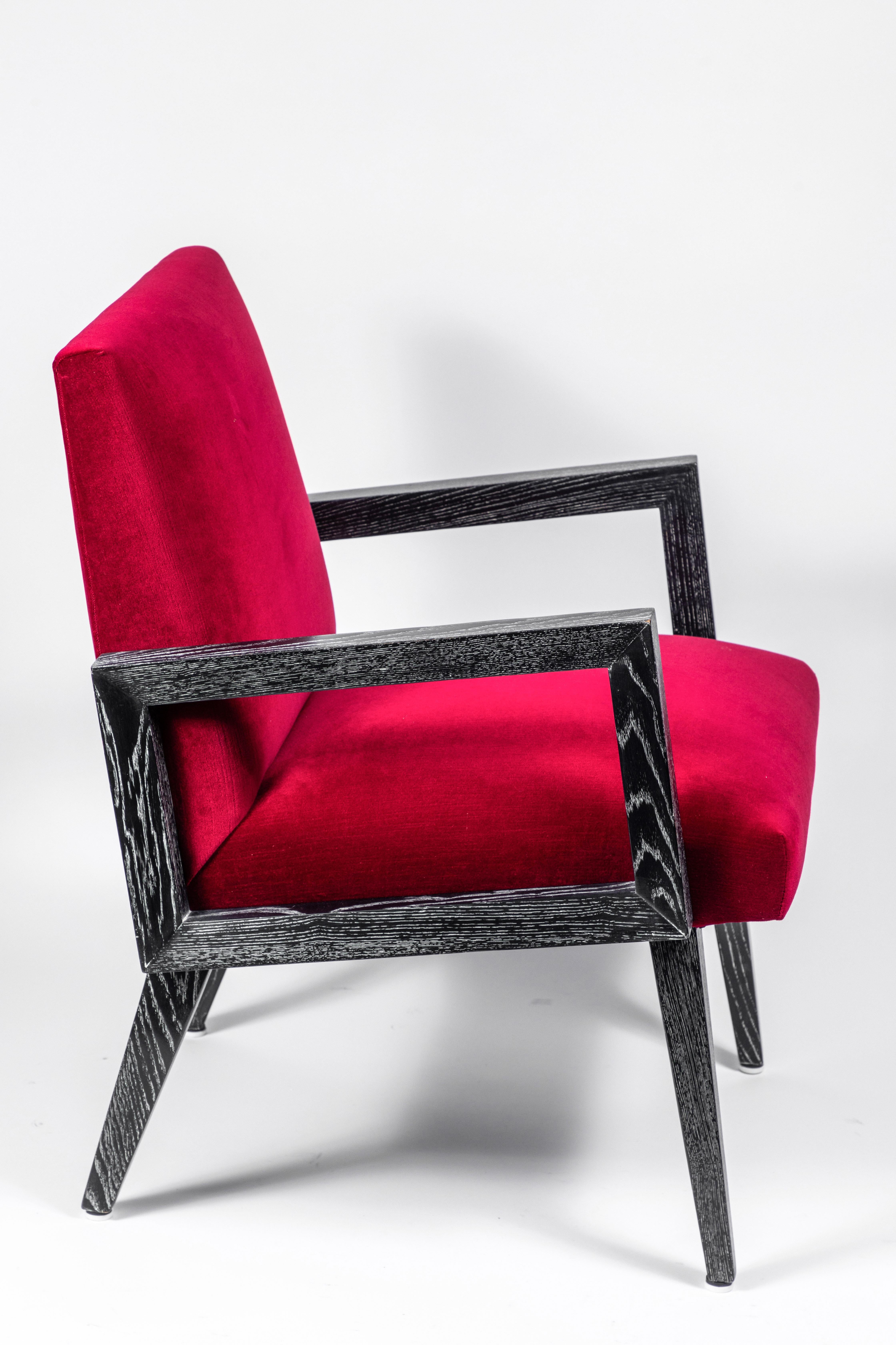 Handsome, masculine pair of midcentury Paul Frankl chairs in cerused oak. Chairs have been newly refinished and reupholstered in a garnet color velvet.