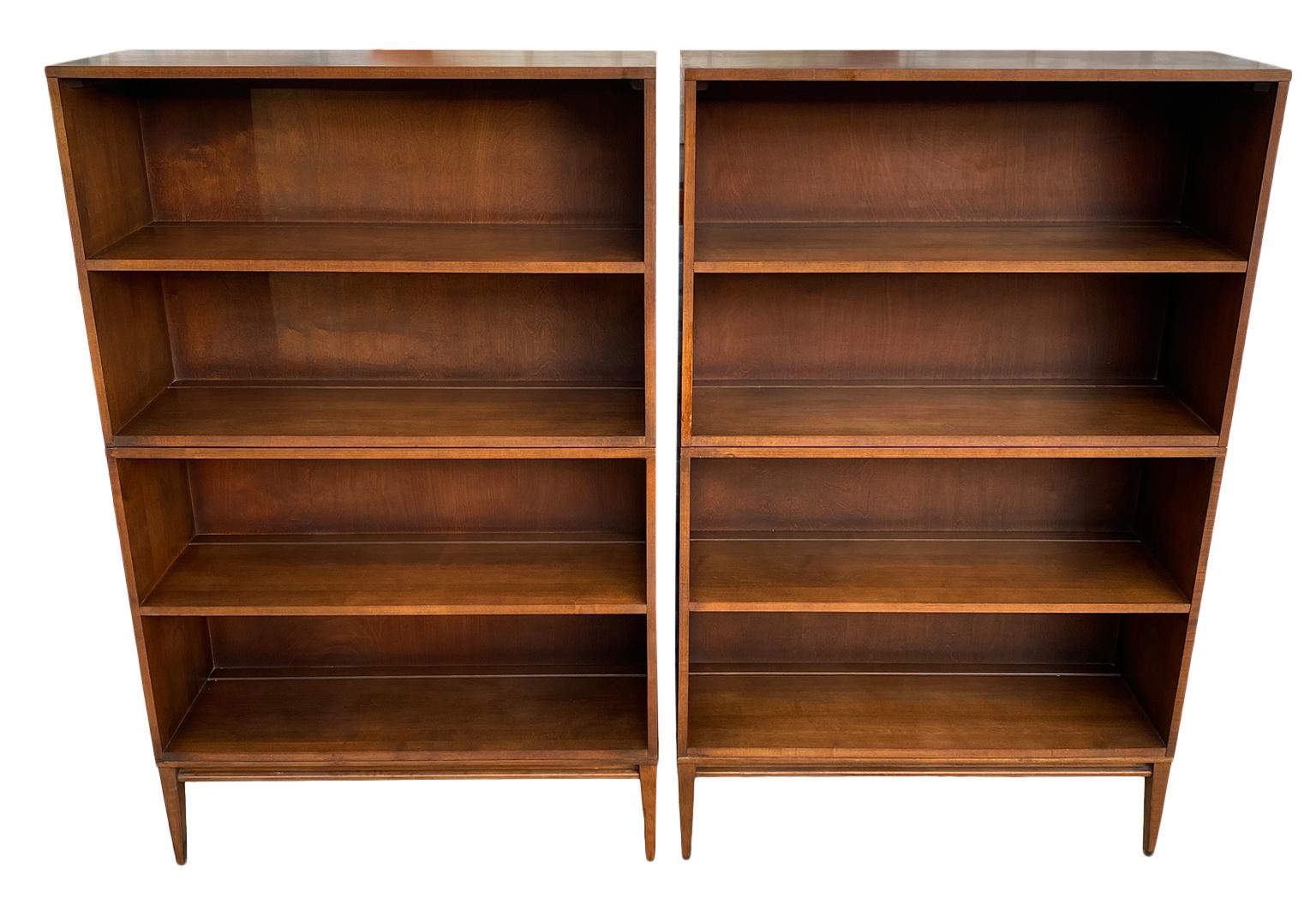 Pair of vintage midcentury Paul McCobb Double high bookcases bookshelves #1516 original walnut finish over solid maple with solid maple 4 leg base. Beautiful bookcase set by Paul McCobb, circa 1950s Planner Group, single center fixed shelf, solid