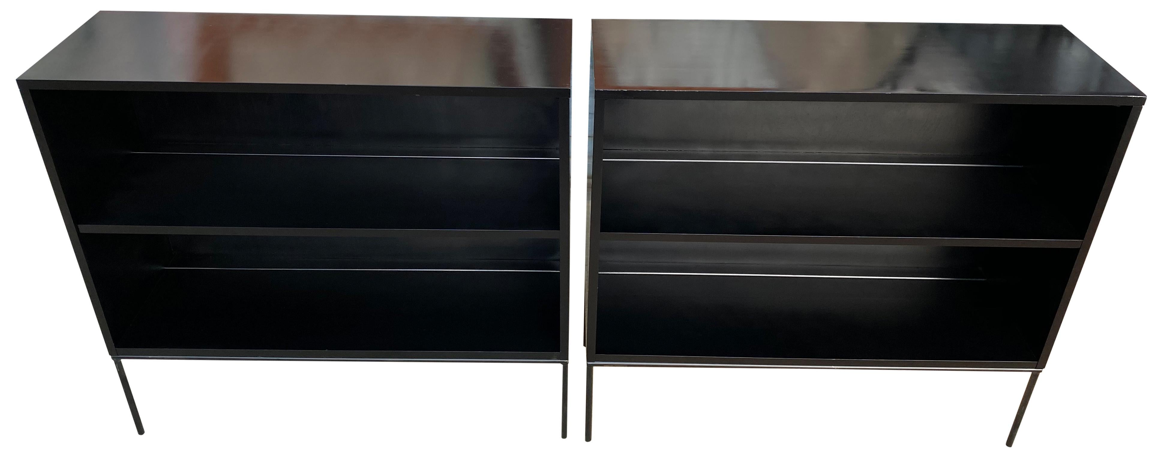 Pair of vintage midcentury Paul McCobb single bookcase #1516 black lacquer over maple with iron base. Beautiful bookcase set by Paul McCobb, circa 1950s Planner Group, single center fixed shelf, solid maple with black finish on rare iron base. Good