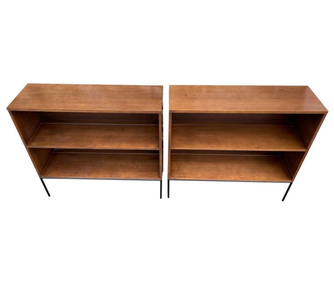 Pair of vintage midcentury Paul McCobb single high bookcases bookshelves #1516 original walnut finish over solid maple with black iron 4 leg base. Beautiful bookcase set by Paul McCobb, circa 1950s Planner Group, single center fixed shelf - all