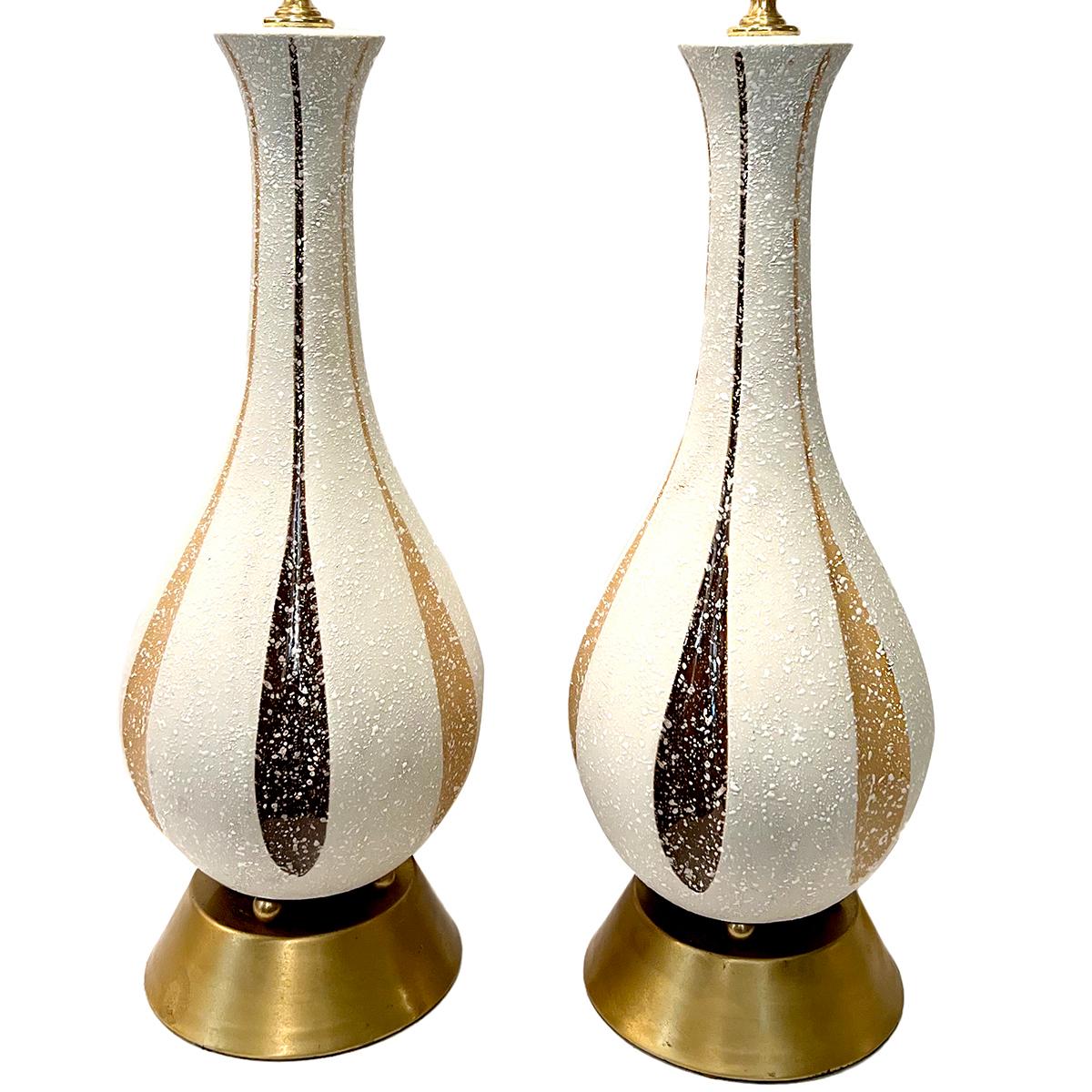 Pair of circa 1950s Italian porcelain lamps.

Measurements:
Height of body: 19.5?
Height to shade rest: 27.5?
Diameter: 6.75?.