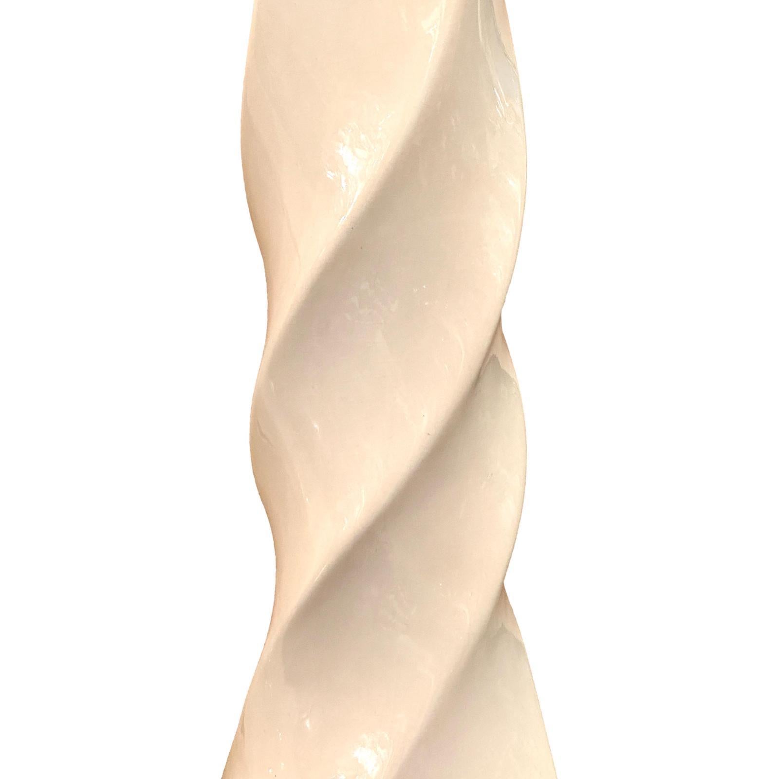 Pair of circa 1950's Italian twisted column cream porcelain lamps.

Measurements:
Height of body: 20