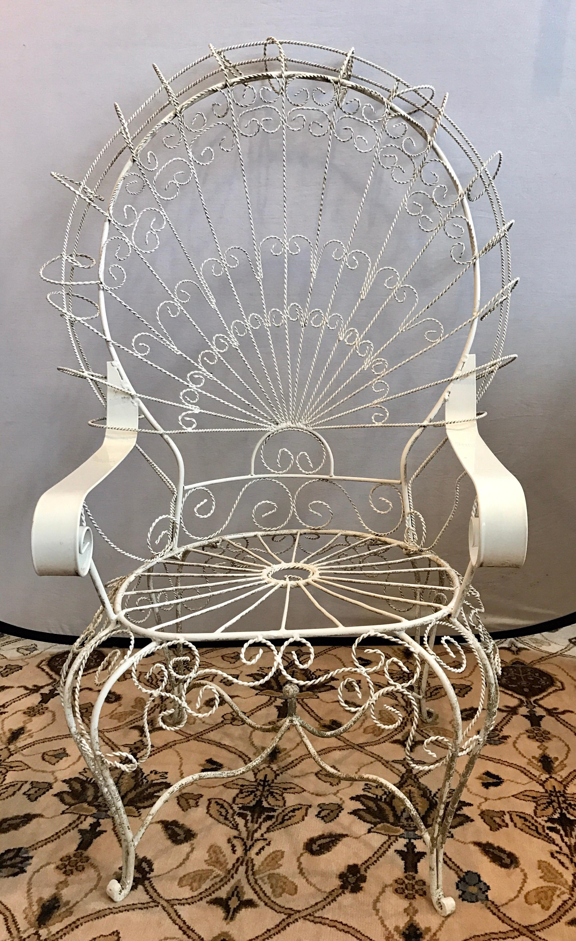 Set of John Salterini classics includes an armchair and a rocker. Made of white wrought iron and features the signature Salterini peacock back.