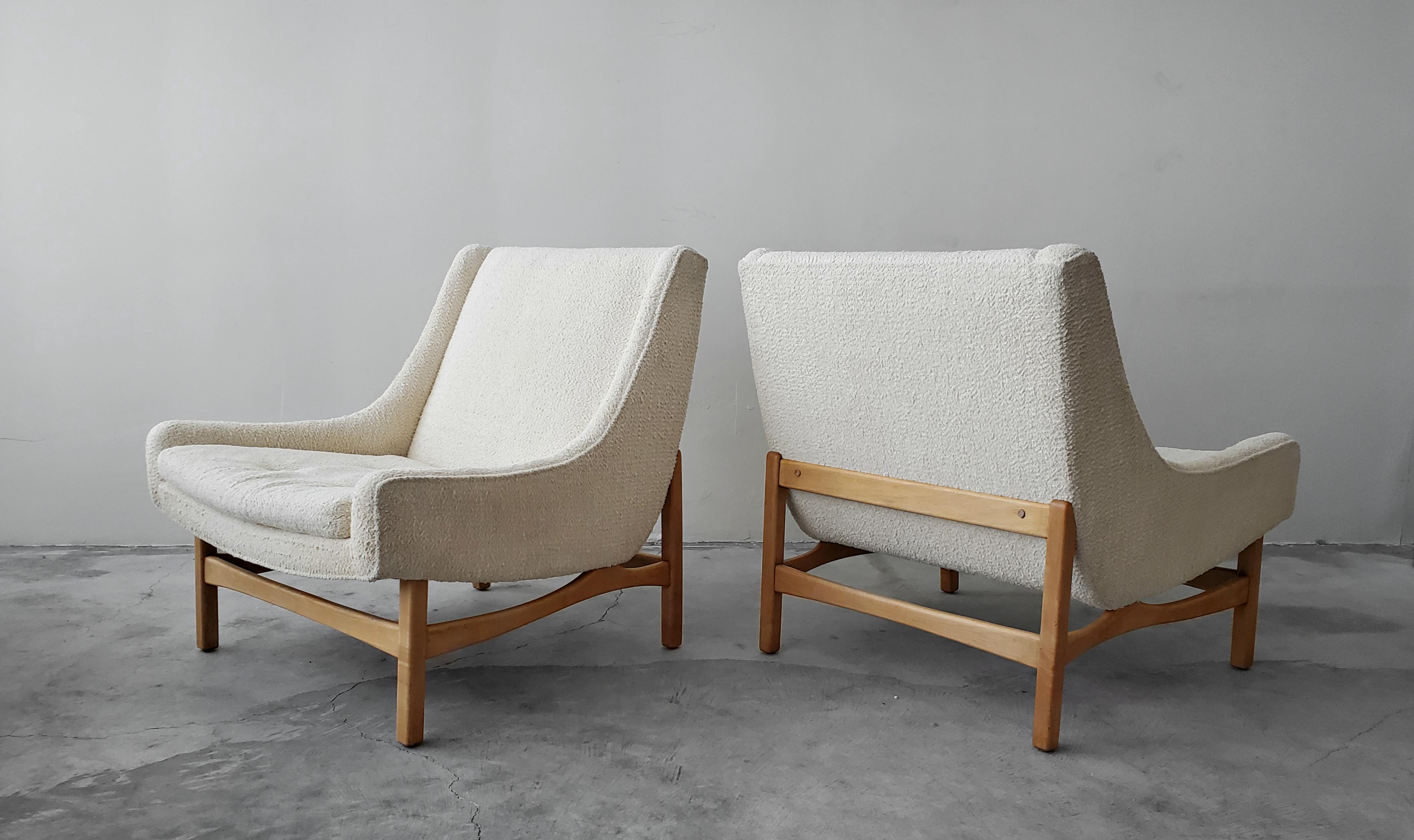 If you're looking for a great pair of midcentury lounge chairs, with the most amazing lines, look no further. These chairs are absolutely stunning from Every Angle.

We have left them as found in their all original bouclé fabric to give an idea of