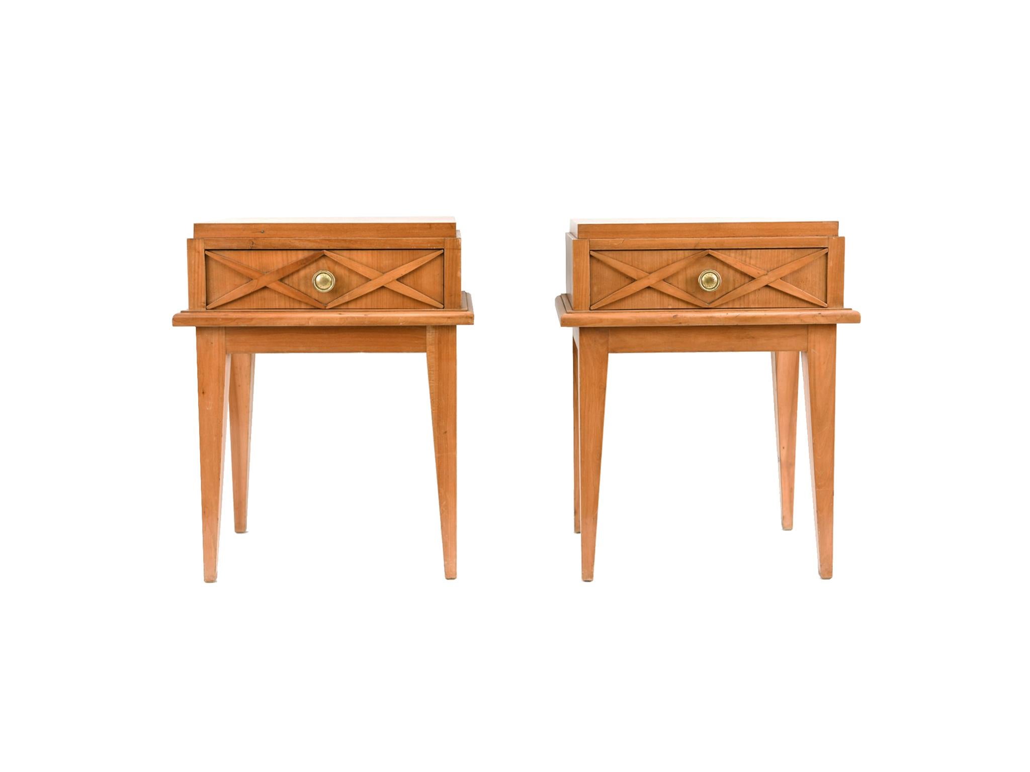 A finely crafted pair of side tables designed in the manner of Maison Gouffé, Paris. Manufactured in the 1950s. The tables are made of beechwood with brass pulls. Their design is in the spirit of neoclassical furniture: simplicity in form, symmetry,