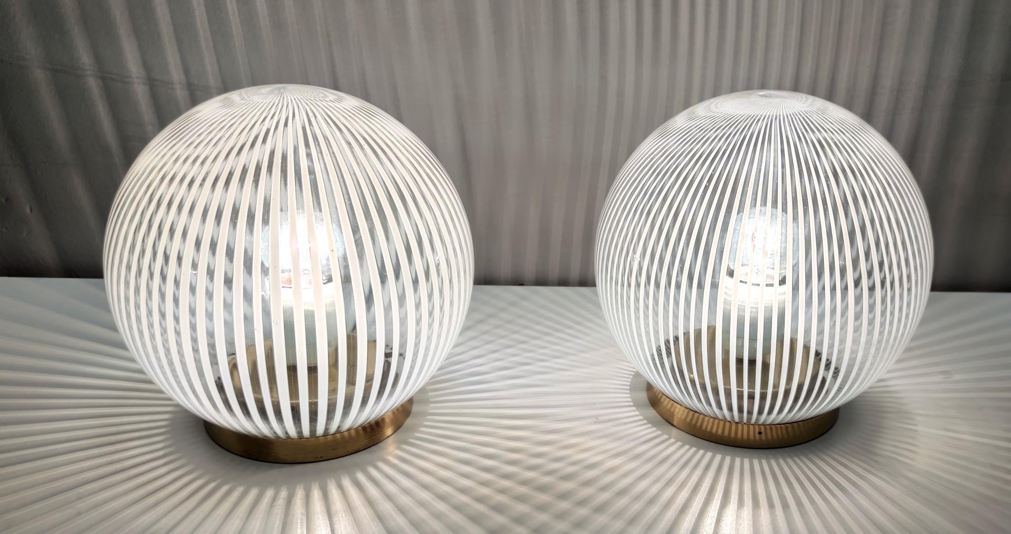 Made in Italy, 1970s.
Made in Murano glass and brass.
These table lamps are vintage pieces, therefore they might show slight traces of use, but they can be considered as in excellent original condition and ready to give a beautiful ambiance to any