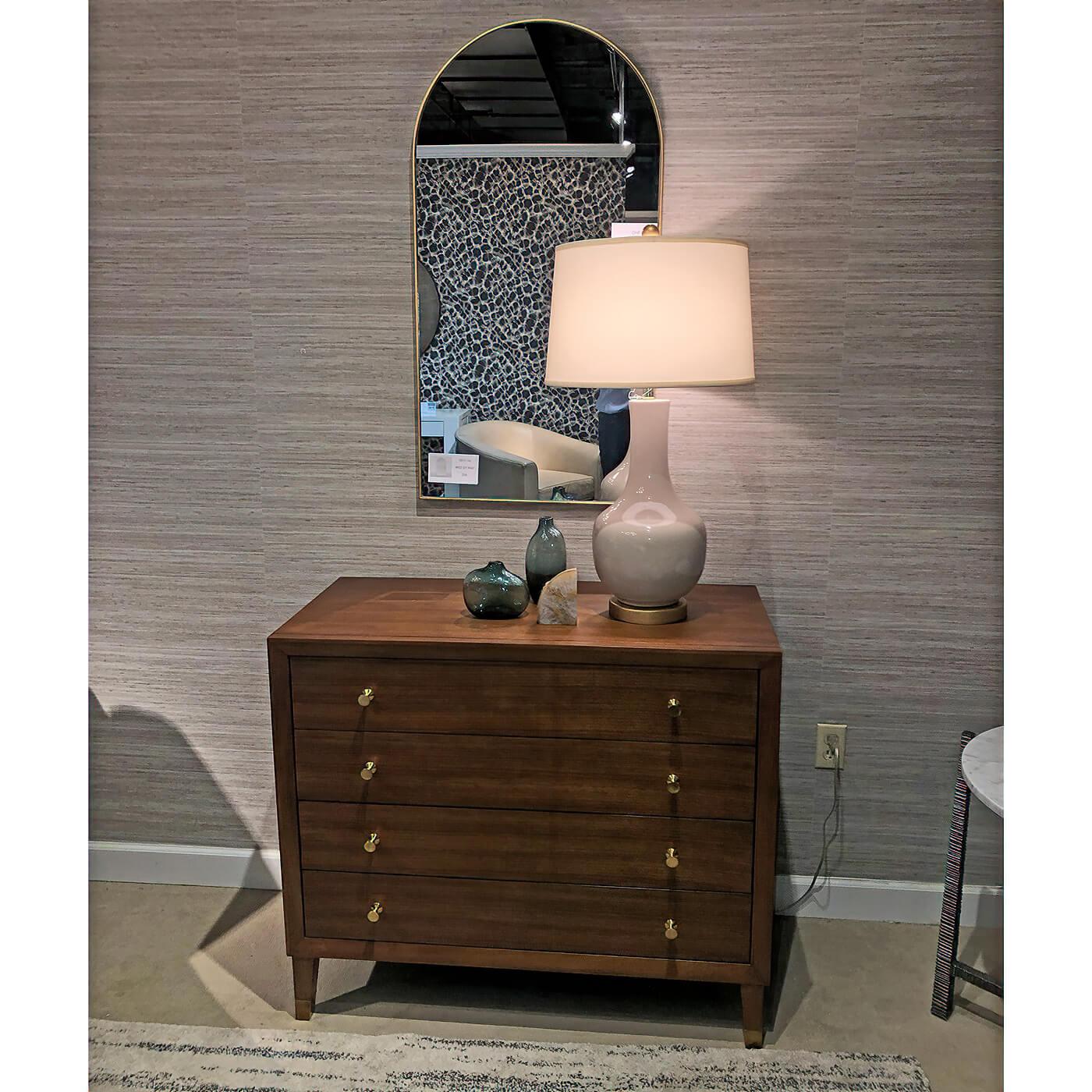 Midcentury style beveled chest with solid walnut frame, four drawers, polished brass hardware, with a hand-rubbed sophisticated “truffle” brown stain that accentuates the clear light and dark tones of the quarter cut walnut veneer and solid walnut