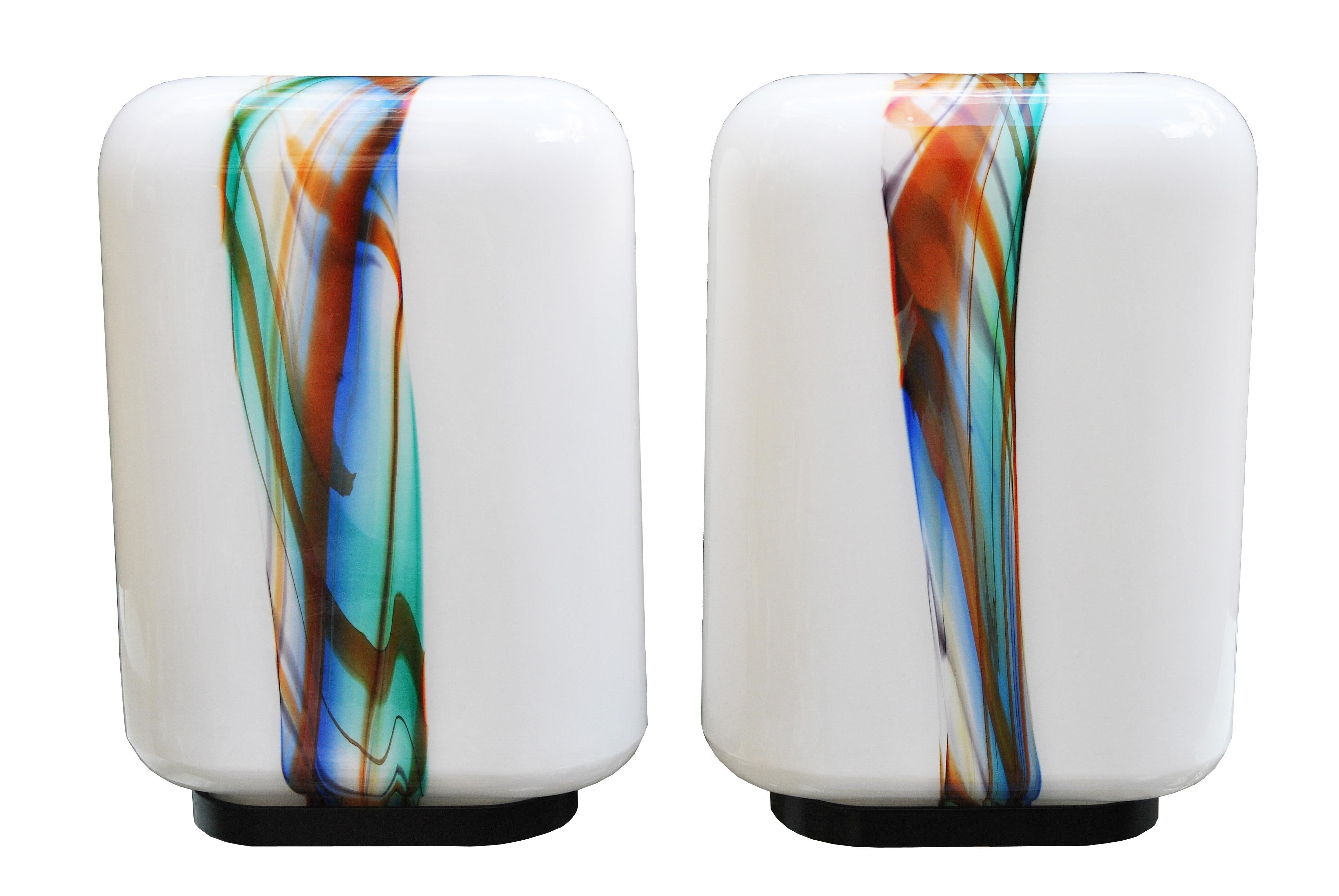 Amazing pair of midcentury table lamps after Ken Scott in white opaline glass with polychromatic pattern and iron base.