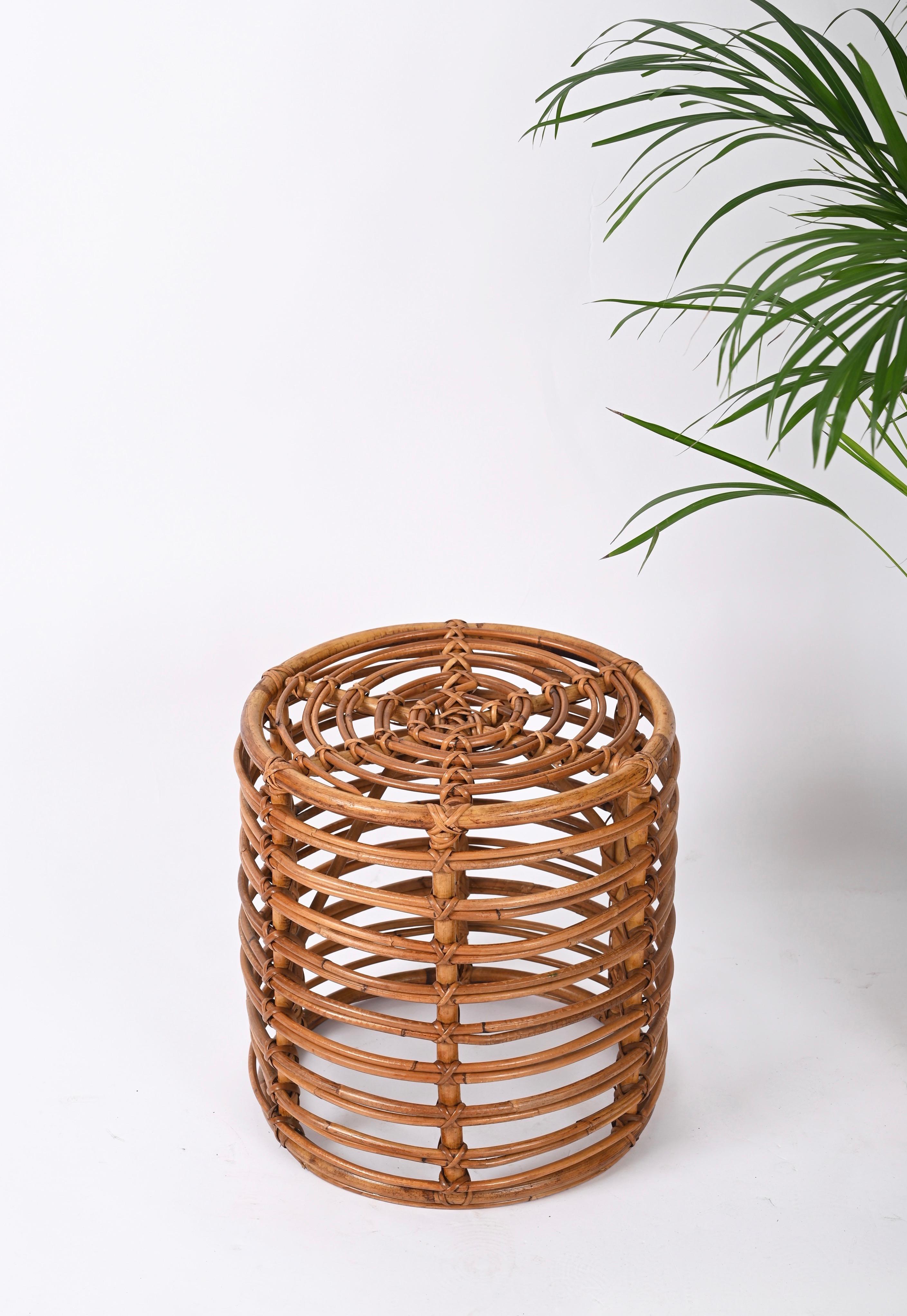 Beautiful pair of Tito Agnoli stools in rattan and bamboo. These fantastic and rare poufs were made in Italy during the 1960s.

The craftsmanship of these stools is exceptional and the curved bamboo structure allows each to be light and solid at the