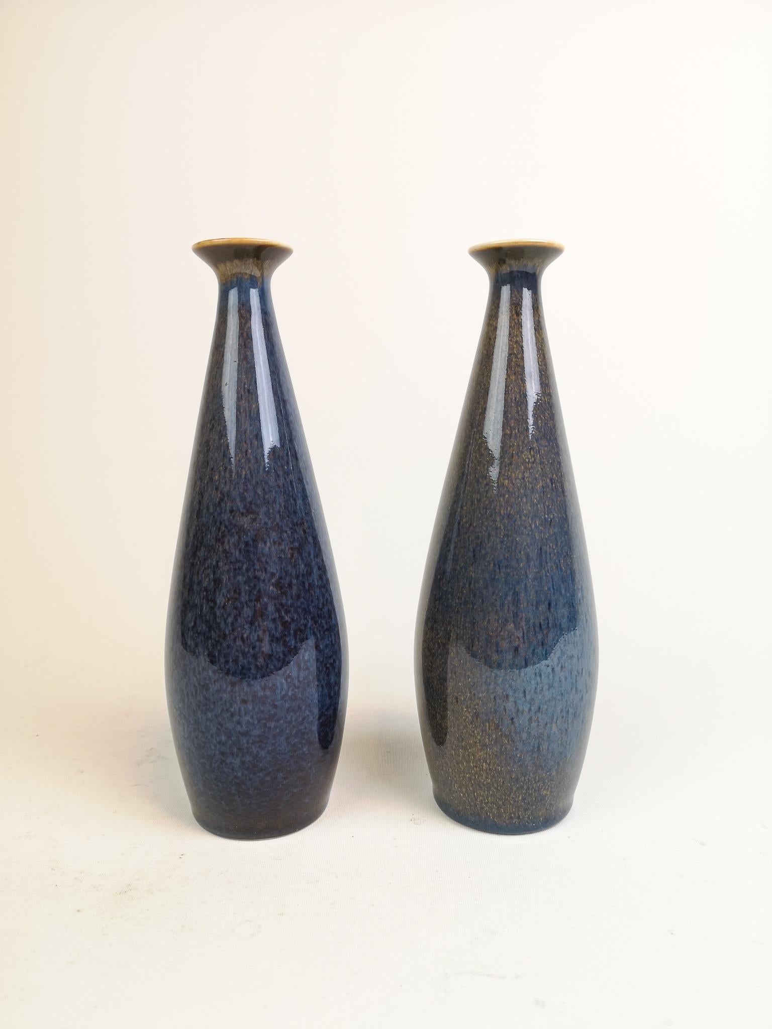 These vases from Rörstrand and maker/designer Carl Harry Stålhane, gives a great impression of style and color. 
Made in Sweden in the midcentury. Beautiful glazed vases in good condition.


Measures: H 23 cm, D 8 cm.


.
